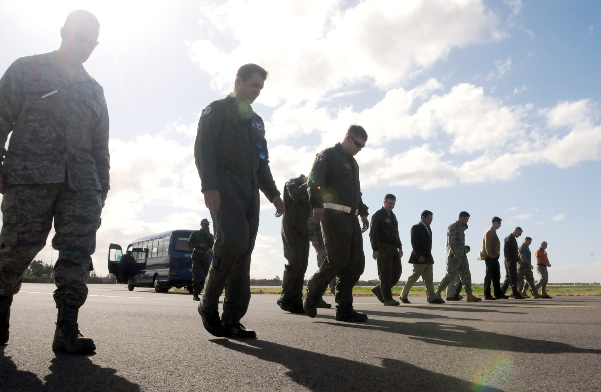 Members of the 17th Air Force (Air Forces Africa),  86th Airlift Wing, Ramstein Air Base, Germany, South Carolina Air National Guard and U.S. Embassy team members do a forgeign object damange on the Marrakech, Morocco, flightline before F-16 Fighting Flacons from the 169th Fighter Wing South Carolina Air National Guard arrive. A FOD walk is performed to remove any objects from the ground that may be ingested by the F-16s intakes during landing. U. S. Air Force aircraft at the event will include two F-16s from the 169th FW, a KC-135 Stratotanker from the 151st Air Refueling Wing, Utah ANG; and a C-130J Super Hercules from the 86th AW. (U.S. Air Force photo by Staff Sgt. Stefanie Torres)