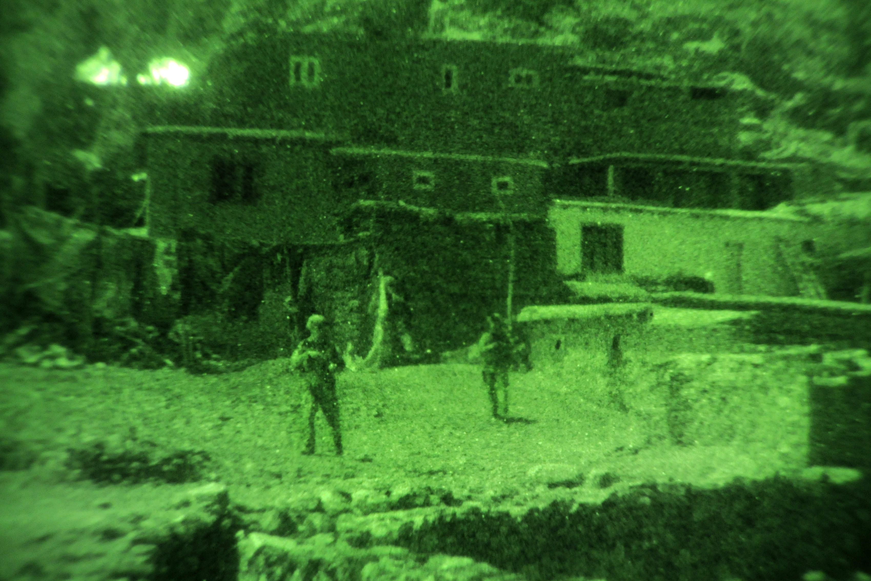As Seen Through A Night Vision Device Kunar Provincial Reconstruction Team And Security Forces Members Move