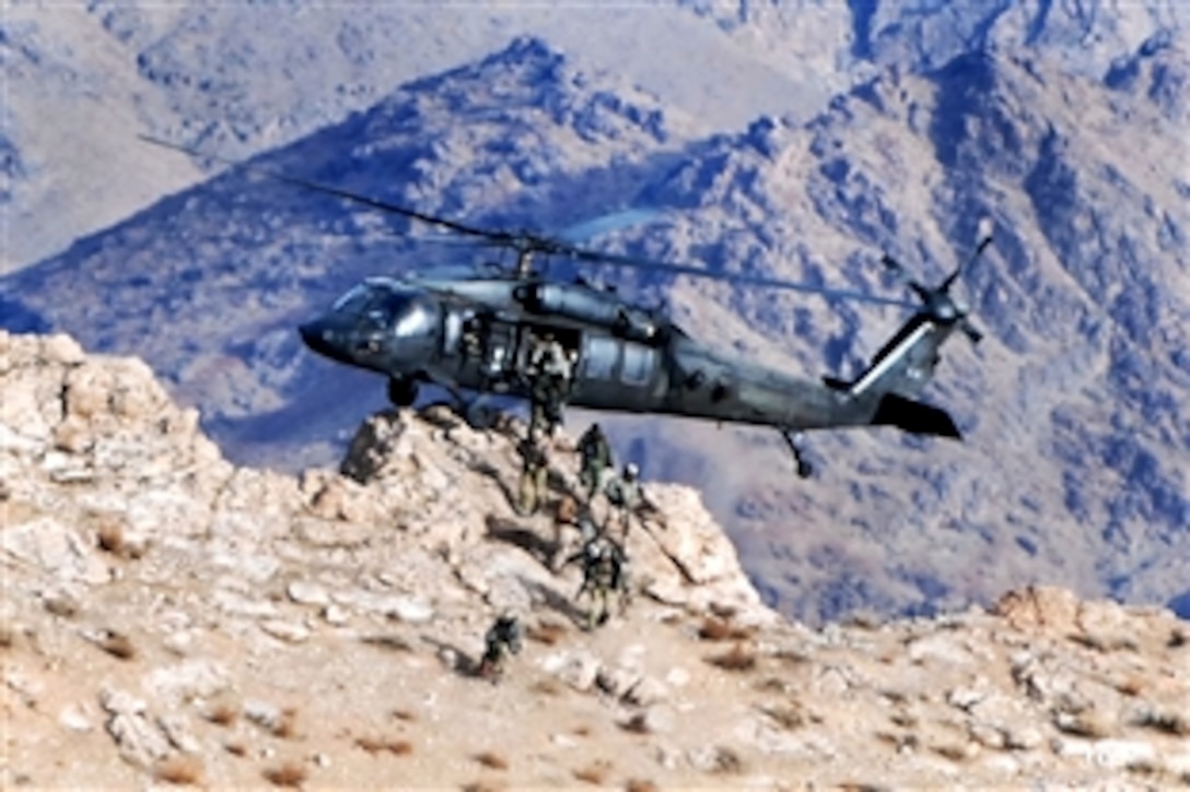 U.S. Special Forces dismount from a U. S. Army UH-60 Black Hawk helicopter while executing a pinnacle landing on a mountain peak to disrupt insurgent communications in Zabul province, Afghanistan, Jan. 21, 2010. The Black Hawk crew is assigned to Company A, 2nd Battalion, 82nd Aviation Regiment, 82nd Combat Aviation Brigade.