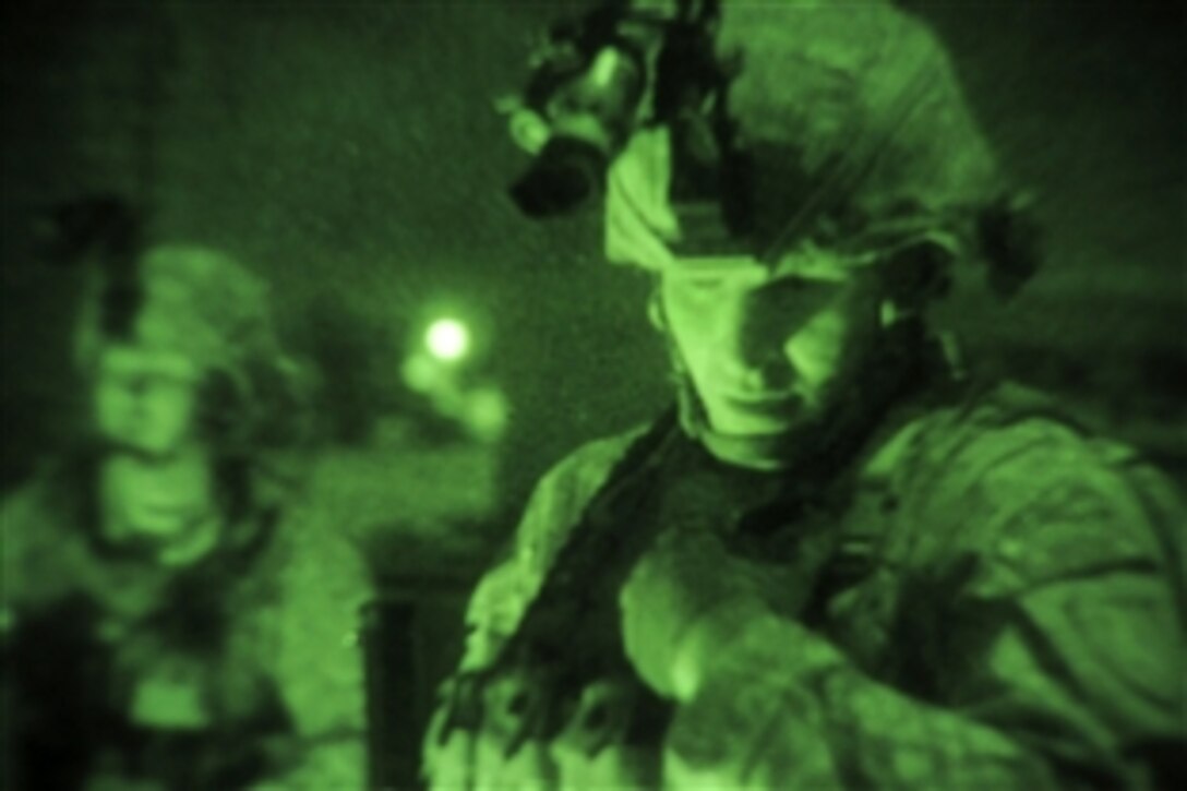 As seen through a night-vision device, U.S. Army Staff Sgt. Chad Melanson performs a night patrol of the perimeter of Camp Wright in Asadabad, Afghanistan, Jan. 24, 2010. Melanson is a Kunar Provincial Reconstruction Team and security forces member assigned to the Nevada National Guard’s 1st Squadron, 221st Calvary Regiment.