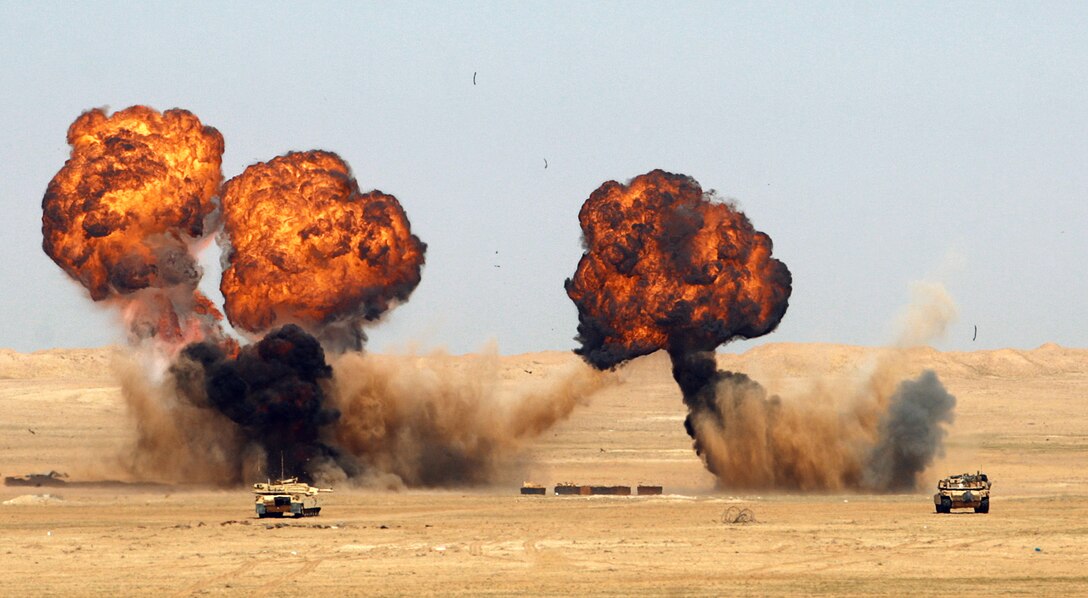 Fireballs ignited by 11th Marine Expeditionary Unit combat engineers burst upward over a military range here Jan. 27 during a bilateral training exercise conducted by the unit’s ground combat element, Battalion Landing Team 2/4, and Kuwaiti military.