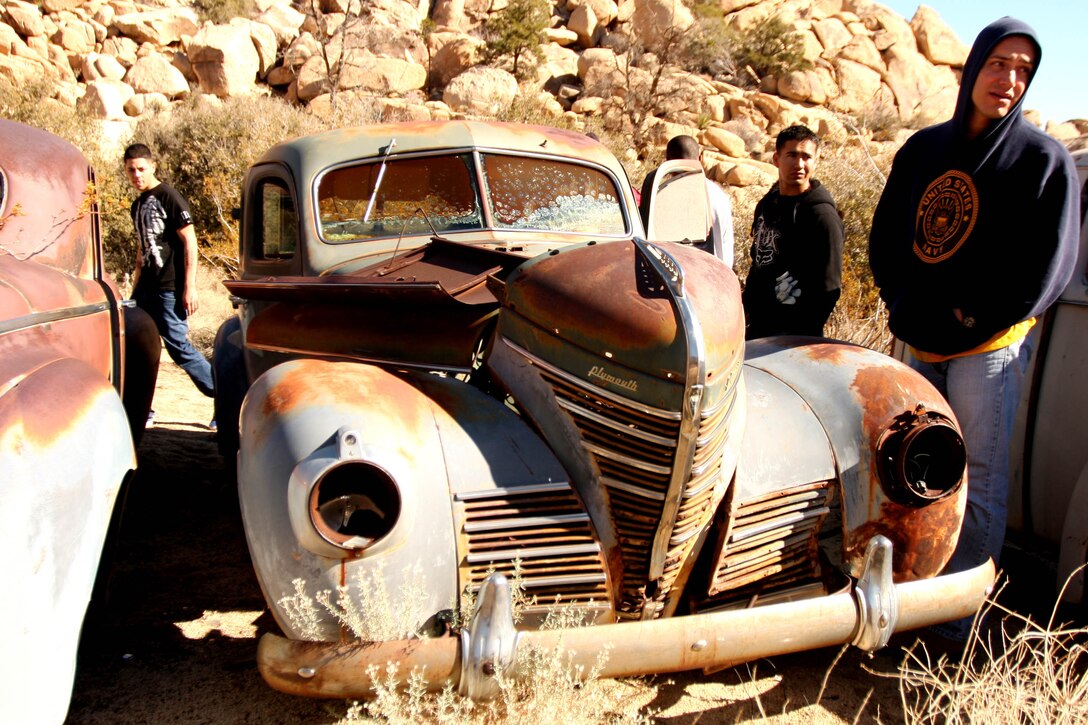 Marines and sailors with 3rd Combat Engineer Battalion, check out a few of the old, rusted cars which dot the landscape of Keys Ranch in Joshua Tree National park Jan. 28. Fourteen Marines and sailors from the battalion volunteered their day to help restore a cabin which had succumbed to the harsh climate of the Mojave Desert and remove unwanted vegetation from the ranch.