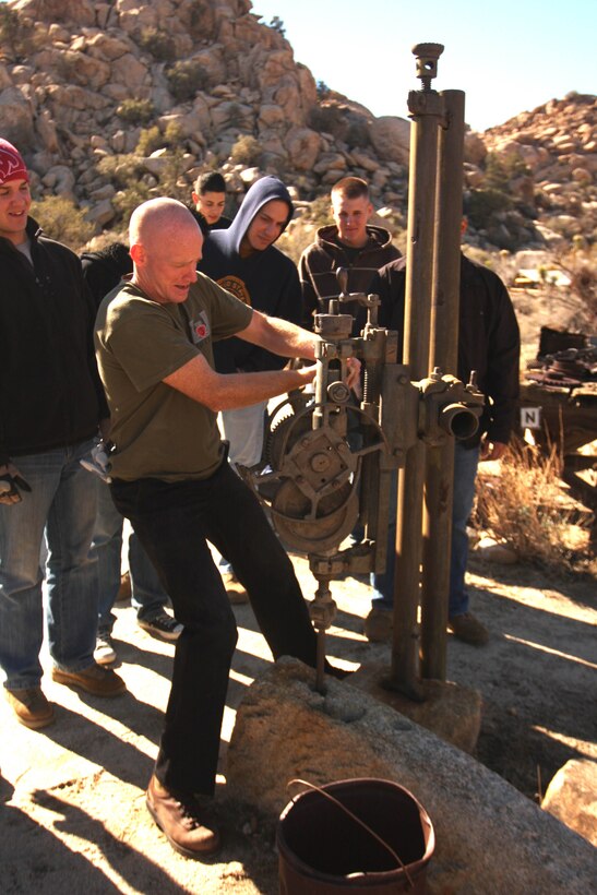 Navy Lt. Bryan Davenport, the chaplain of 3rd Combat Engineer Battalion, works an old masonry tool left on Keys Ranch in Joshua Tree National Park during a guided tour Jan. 28. Davenport and 13 other Marines and sailors from the battalion to help restore a cabin which had succumbed to the harsh climate of the Mojave Desert and removed unwanted vegetation from the ranch.