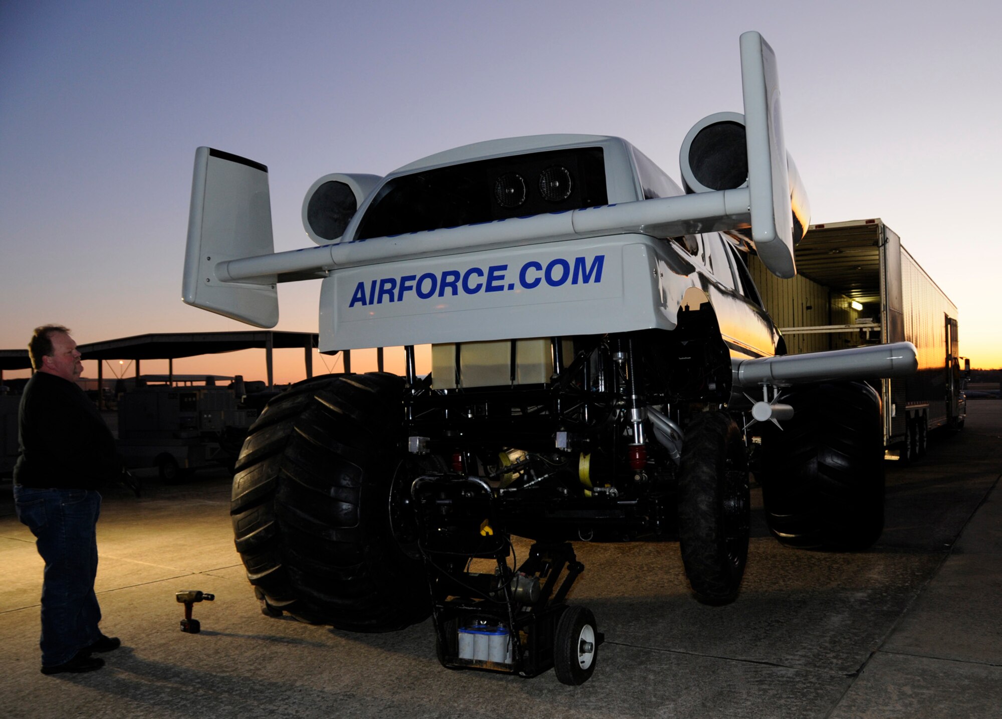 Robbe Cartwright, an A-10 monster truck crew member, labors to assemble the vehicle prior to a photo and video shoot with U.S. Air Force Recruiting Services Jan. 26, 2010, at the 188th Fighter Wing in Fort Smith, Ark. (U.S. Air Force photo by Capt. Heath Allen/188th Fighter Wing Public Affairs)