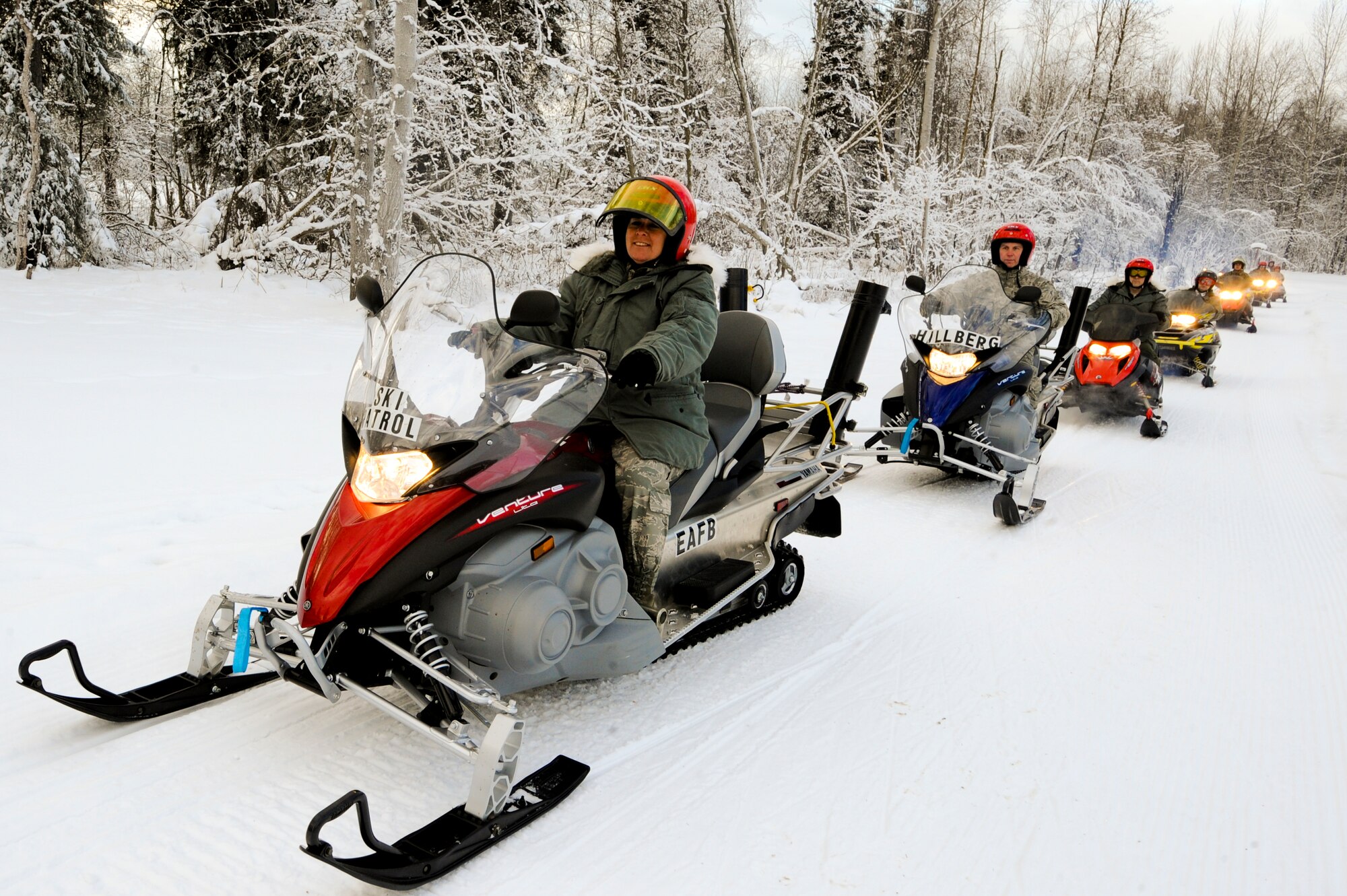ELMENDORF AIR FORCE BASE, Alaska -- Maj. Gen. Anita Gallentine, lead inspector of the 2010 Installation Excellence Award team, leads the team on a snow-machine tour of the Elmendorf Air Force Base's cross country skiing trail. The trail is one of many highlights that Elmendorf showcased to the inspection team. Elmendorf was selected along with Dover Air Force Base, Del., as one of two finalists for the Air Force for the Commander in Chiefs Installation Excellence Award. (Air Force photo by Staff Sgt. Joshua Garcia)