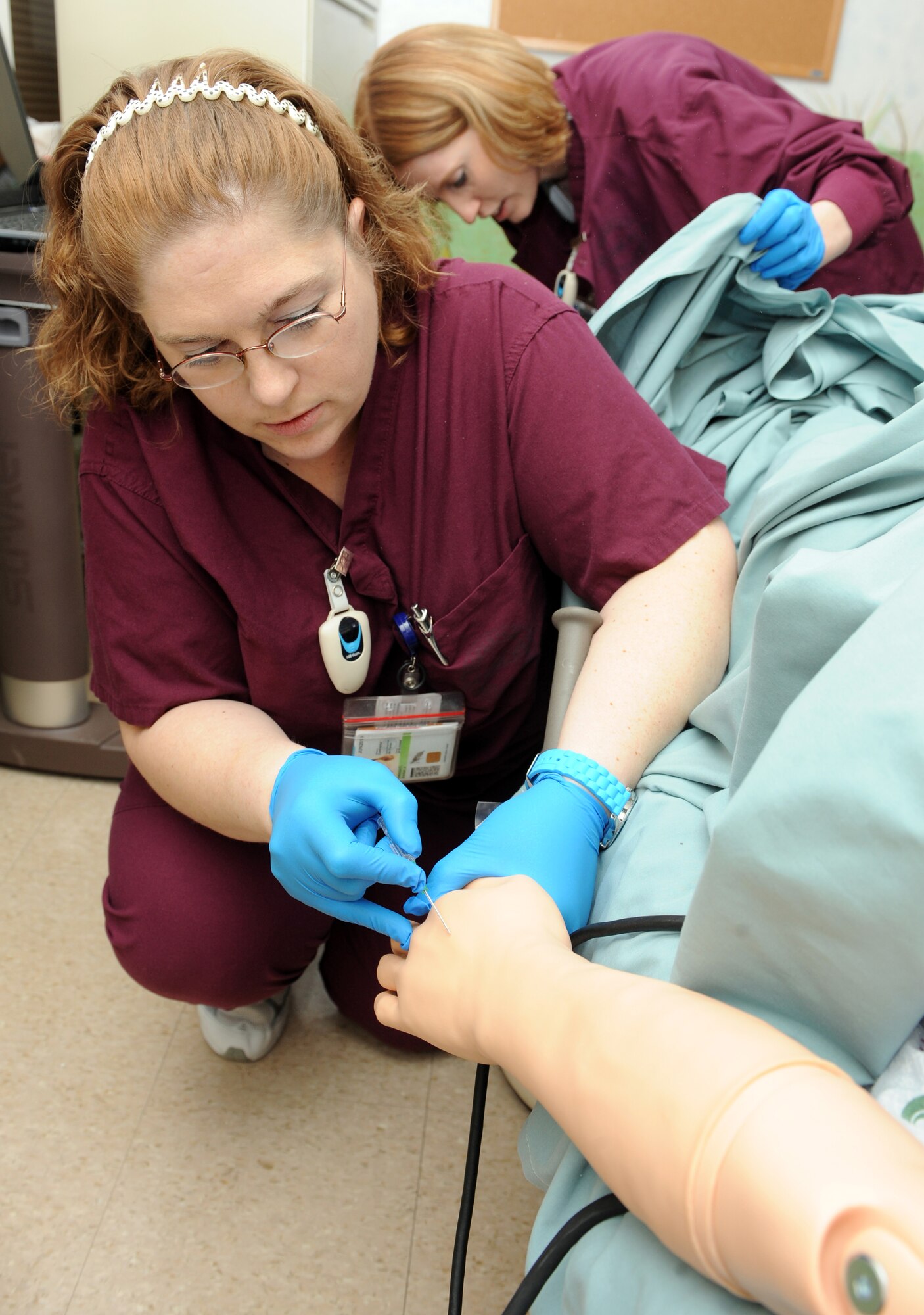 MOUNTAIN HOME AIR FORCE BASE, Idaho -- Rana Wright, 366th Medical Surgical Squadron family care unit nurse, simulates giving intravenous therapy Jan. 25. The 366th Medical Group has a new obstetrics emergency simulator, which is used to simulate a variety of rare, but life threatening scenarios. It has computer controlled vital signs, pulses and can bleed and seize which allows medical staff to practice the skills needed in emergency situations. (U.S. Air Force photo by Airman 1st Class Debbie Lockhart)