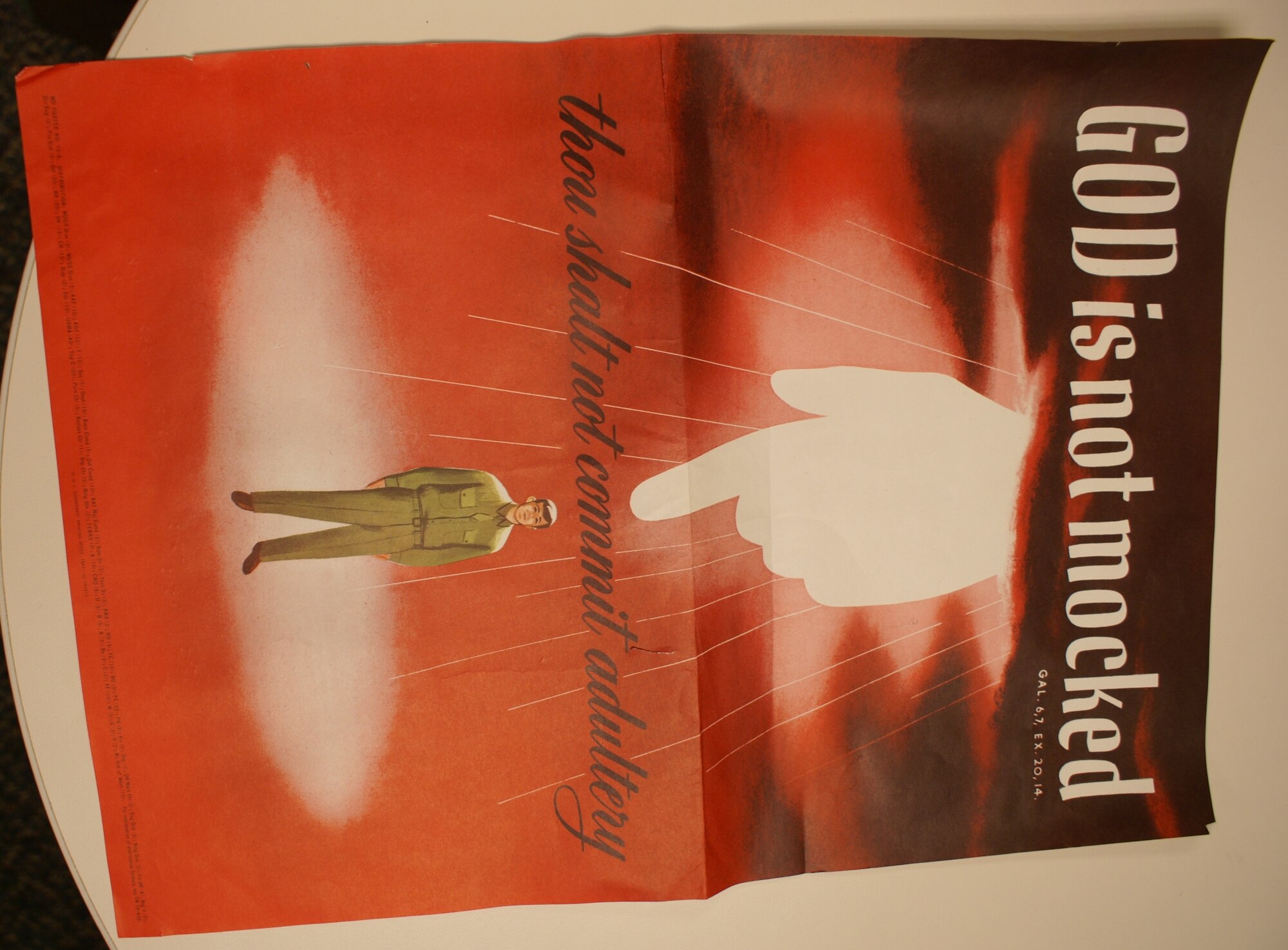 Documents recently discovered under the McChord Chapel include this poster, which warned servicemembers in 1947 that there were potentially harsher consequences of adultery than merely receiving an Article 15. (U.S. Air Force photo/Staff Sgt. Eric Burks)