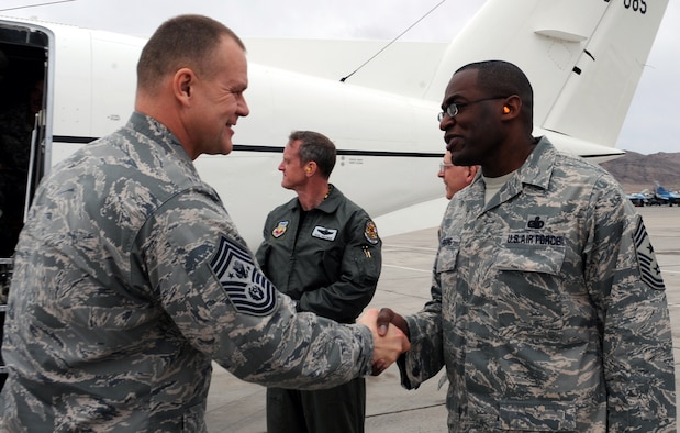 Chief Master Sgt. of the Air Force James A. Roy is greeted by Chief Master Sgt. Alfred Herring at base operations Jan. 22, 2010 at Nellis Air Force Base, Nev. Chief Herring is the  the 99th Air Base Wing command chief. (U.S. Air Force photo/Airman 1st Class Brett Clashman)