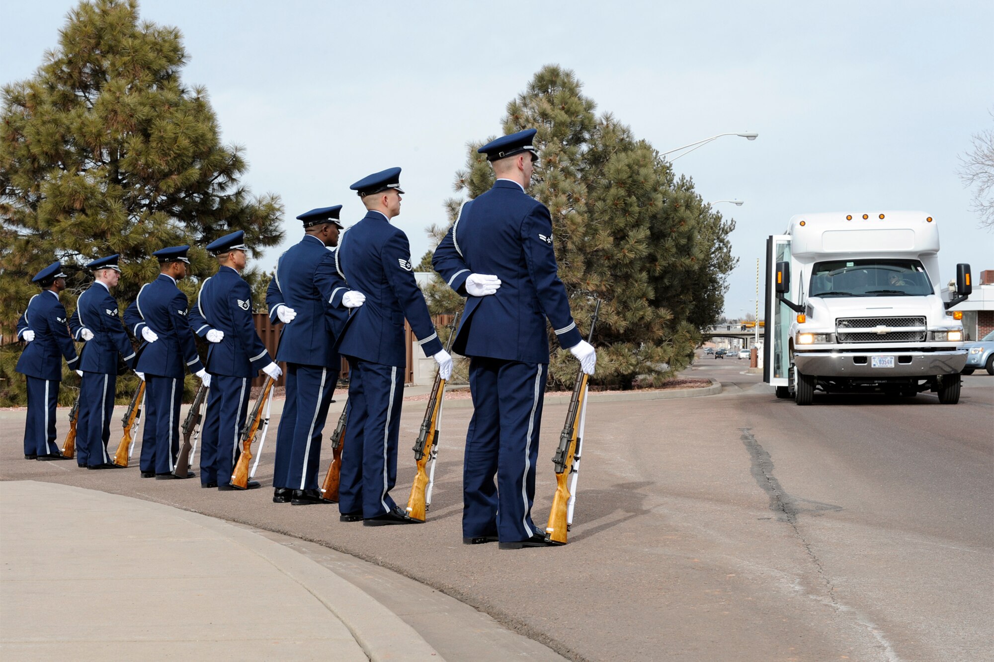 Members of the 21st Force Support Squadron’s High Frontier Honor Guard stand at the entrance of Peterson’s North Gate as the LeMay evaluation team arrives Jan. 21. The six-member team spent two days examining FSS programs and facilities. The 21st FSS is one of four finalists for the Curtis E. LeMay Award, given annually to the best services organization. The winner is expected to be announced at the end of February. (Air Force photo by Craig Denton)