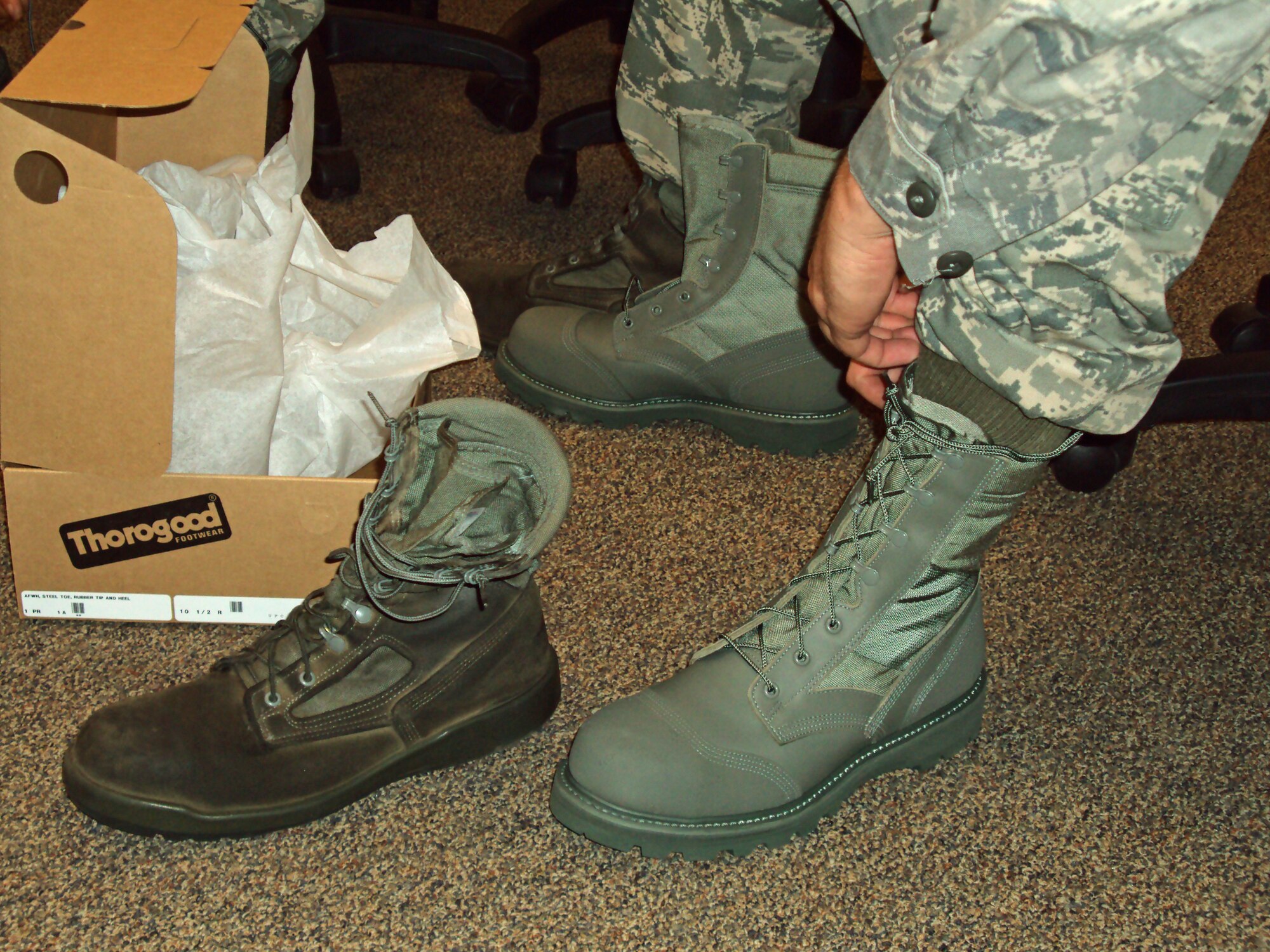 Air Force officials announced findings Jan. 28, 2010 of the recent Airman Battle Uniform boot wear test.  Pictured at right is the boot of choice with a rubber coated toe and heel. Research began to develop a stain-resistant boot to overcome issues with the current suede sage green boot, pictured at left. The Air Force Uniform Office, part of the Aeronautical Systems Center at Wright-Patterson Air Force Base, Ohio, oversaw testing.  (U.S. Air Force photo by Brad Jessmer)

