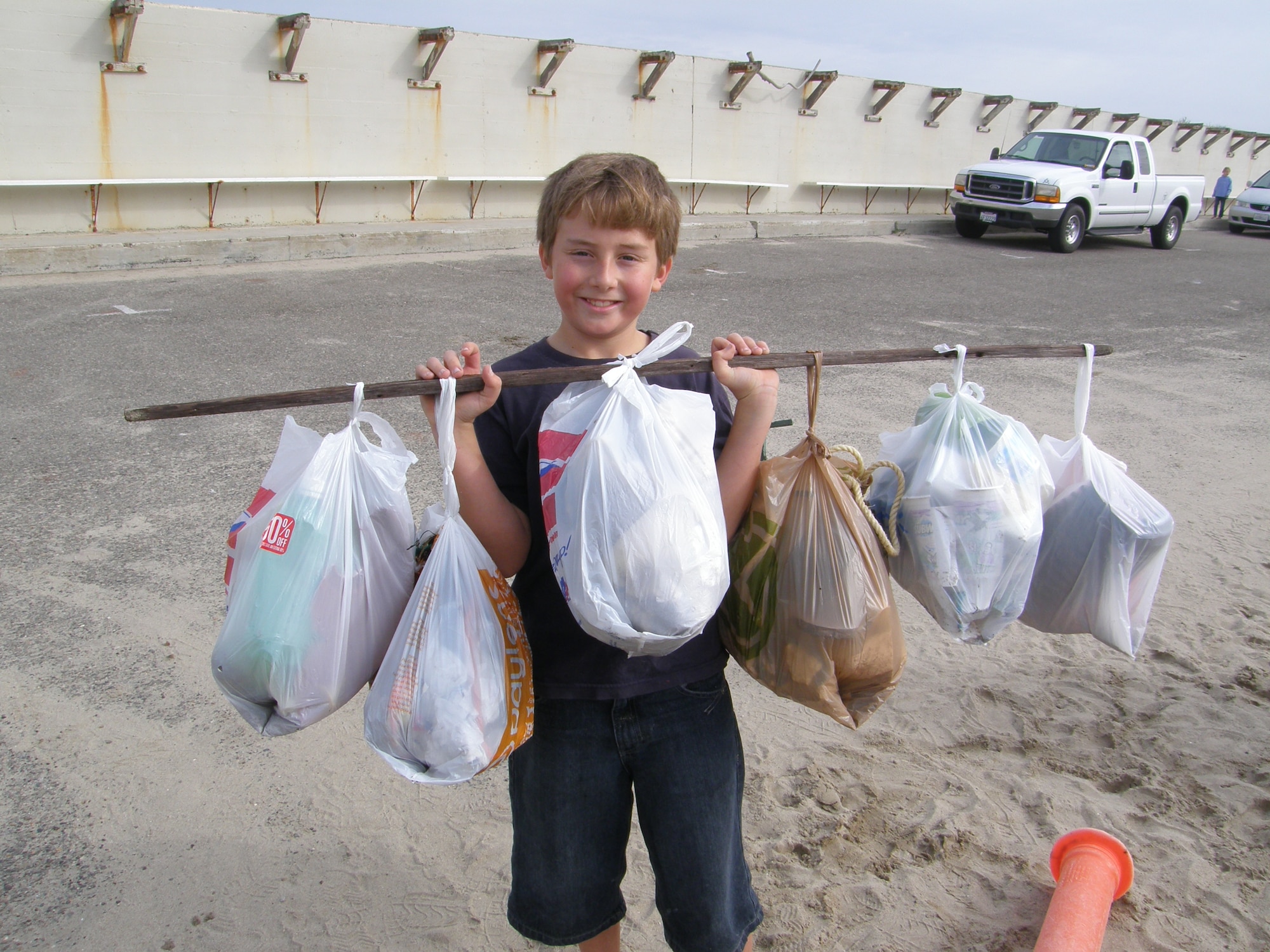 VANDENBERG AIR FORCE BASE, Calif. – Proudly displaying a hard day’s work, Bruin Stricker, of the Vandenberg Home-school Inclusive Partnership, helped clean-up Wall Beach here Monday, Jan. 28, 2010. The team of Vandenberg home-schoolers removed trash and nine tires from the beach. (Courtesy photo/Vandenberg Home-school Inclusive Partnership)
