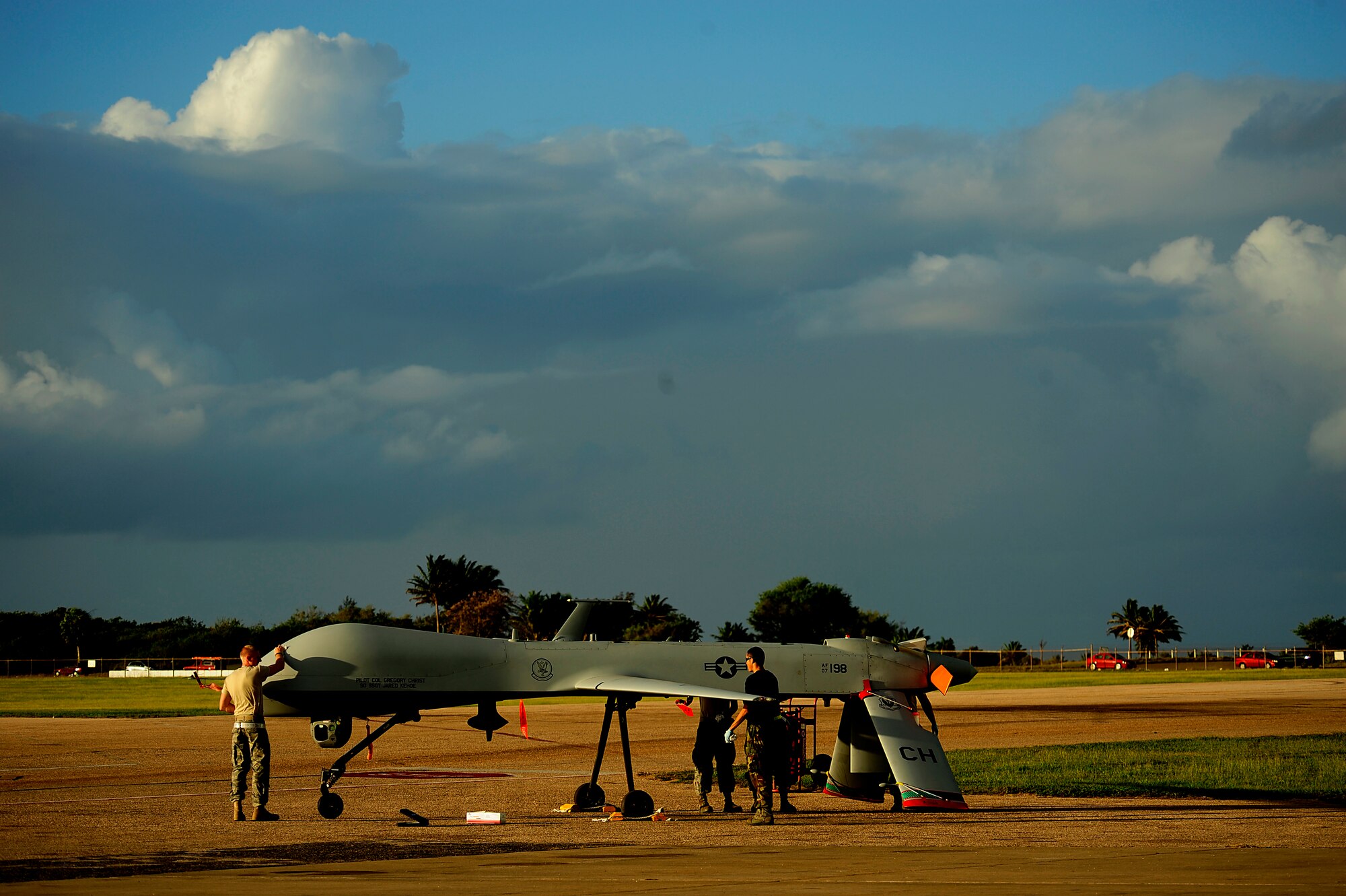 U.S. Air Force maintenance personnel from the 432nd Aircraft Maintenance Sq., Creech Air Force Base, Nevada conduct pre-flight maintenance on an RQ-1 Predator at Aeropuerto Rafael Hernandez outside Aguadilla, Puerto Rico on 28 Jan., 2010.  The RQ-1 remotely piloted systems are operating out of Puerto Rico in support of Operation Unified Response in Haiti.  Airmen from Creech Air Force Base, Las Vegas, Nev. are providing 24 hour a day full-motion video in real time to international relief workers on the ground in order to speed humanitarian aid to remote and cut-off areas of the country following the earthquake on 12 Jan., 2010. (U.S. Air Force photo by Tech. Sgt. James L. Harper Jr.)