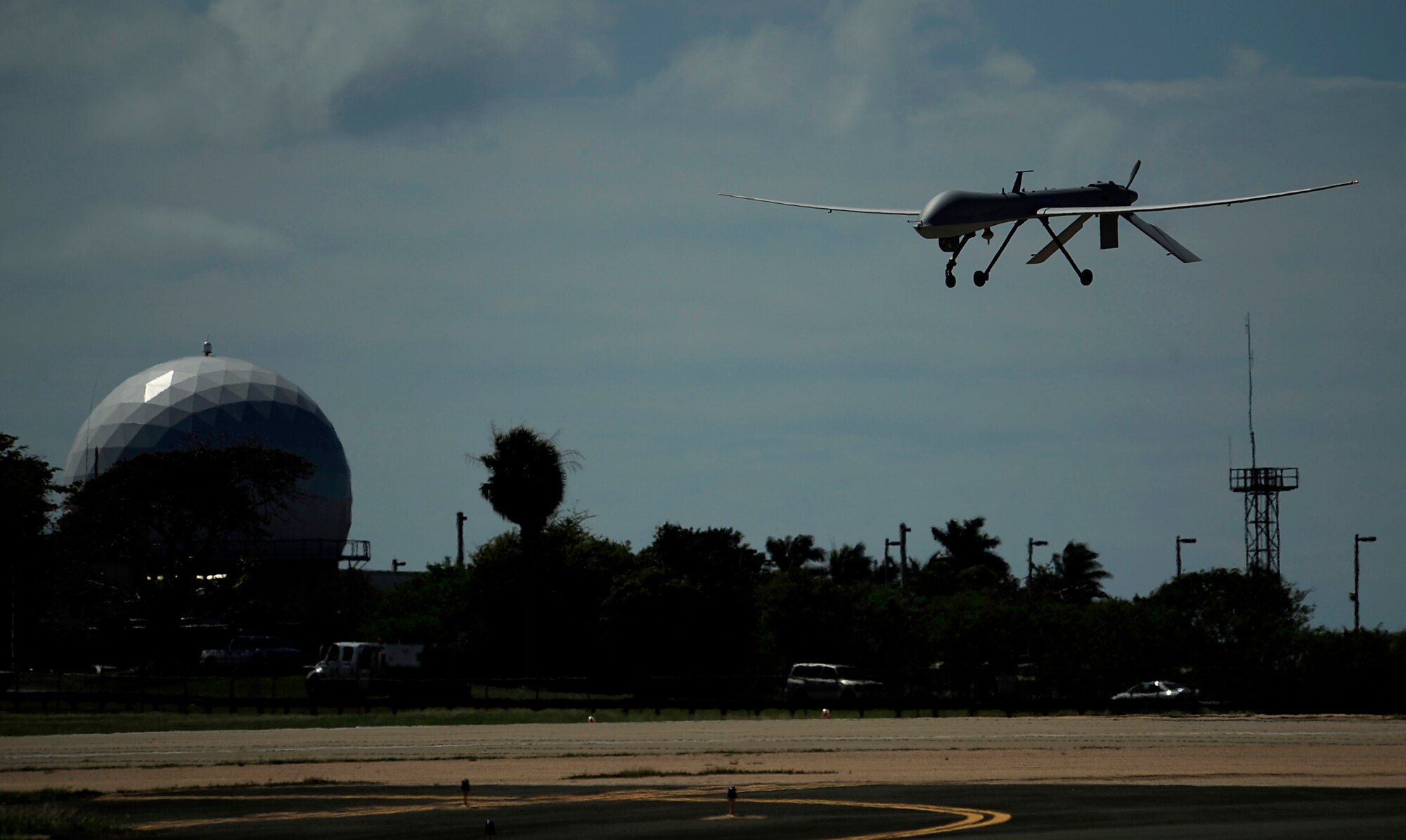 A U.S. Air Force RQ-1 Predator from the 432nd Wing, Creech Air Force Base, Nevada lands at Aeropuerto Rafael Hernandez outside Aguadilla, Puerto Rico on 28 Jan., 2010.  The RQ-1 remotely piloted systems are operating out of Puerto Rico in support of Operation Unified Response in Haiti.  Airmen from Creech Air Force Base, Las Vegas, Nev. are providing 24 hour a day full-motion video in real time to international relief workers on the ground in order to speed humanitarian aid to remote and cut-off areas of the country following the earthquake on 12 Jan., 2010. (U.S. Air Force photo by Tech. Sgt. Jaime Mendez)