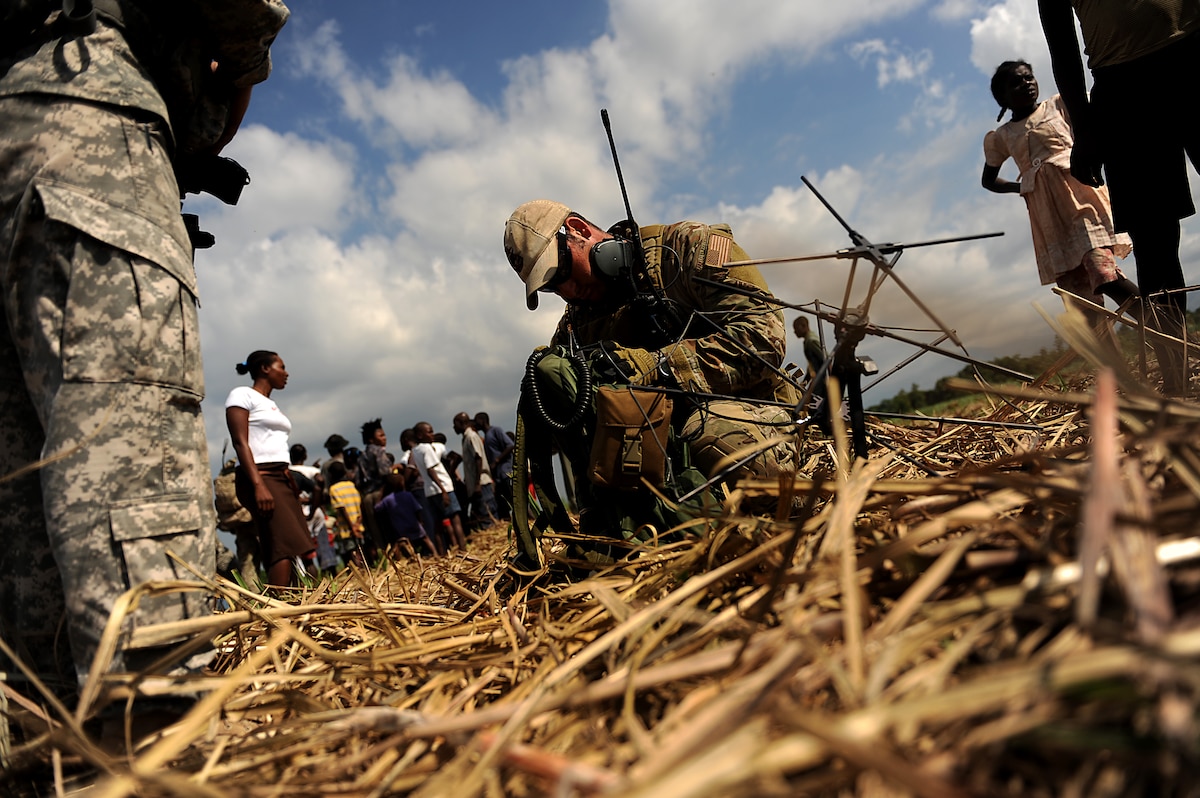 A U.S. Air Force combat controller prepares to contact the special tactics operation center by radio while conducting a drop zone survey in Port-au-Prince, Haiti, Jan. 24, 2010, during Operation Unified Response. (U.S. Air Force photo/Master Sgt. Jeremy Lock) 