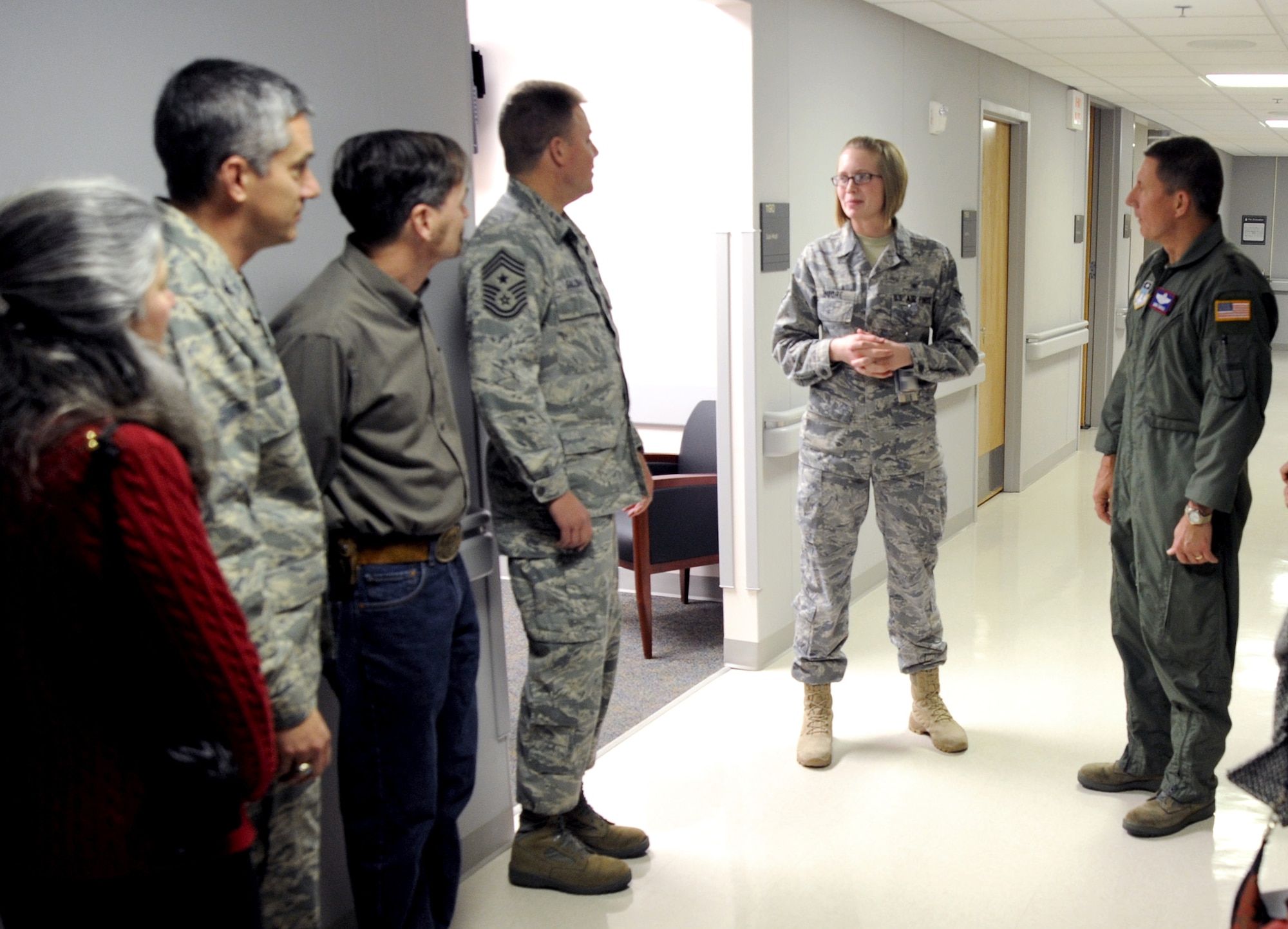 Airman 1st Class Brooke Moore, center, briefs Lt. Gen. Mike Gould, Chief Master Sgt. Todd Salzman and others during a tour of the renovated Air Force Academy Clinic Jan. 22, 2010. The renovations consolidated medical services previously located at the Academy's Milazzo Community Center into the existing facility. Airman Moore is assigned to the 10th Medical Operations Squadron. General Gould is the Academy superintendent, and Chief Salzman is the Academy's command chief master sergeant. (U.S. Air Force photo/Johnny Wilson)