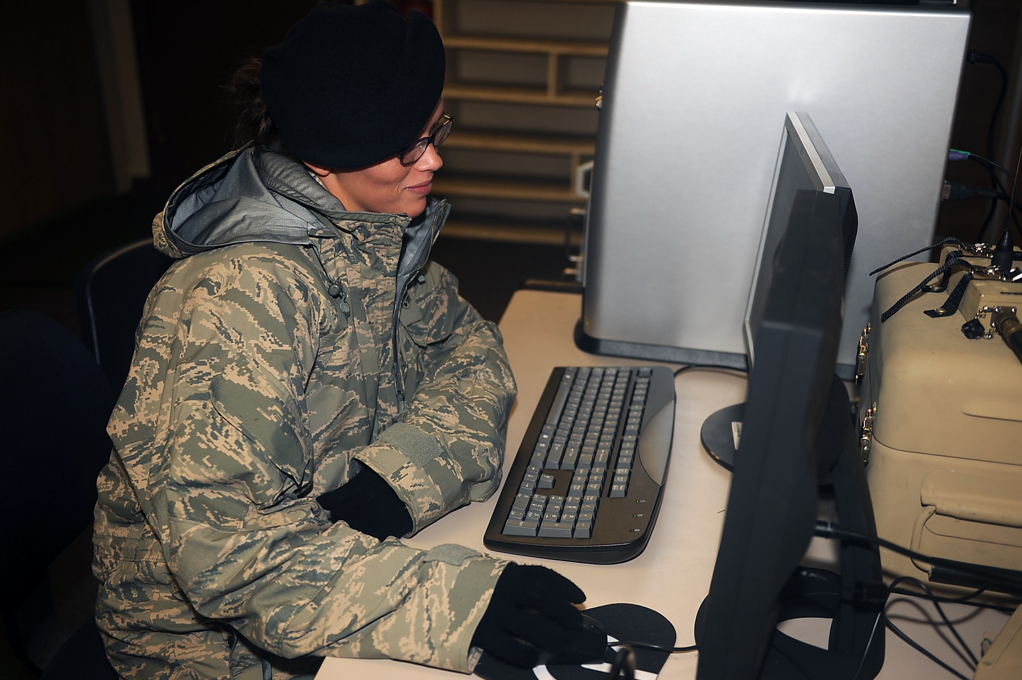 Airman 1st Class Sarah Layton, 4th Security Forces Squadron patrolman, watches the base defense operations center monitoring system during an electronic security system exercise on Seymour Johnson Air Force Base, N.C., Jan. 22, 2010. A BDOC is a command and control facility established by the base commander to serve as the focal point for base security and defense. Layton hails from Ogden, Utah. (U.S. Air Force photo/Senior Airman Ciara Wymbs)