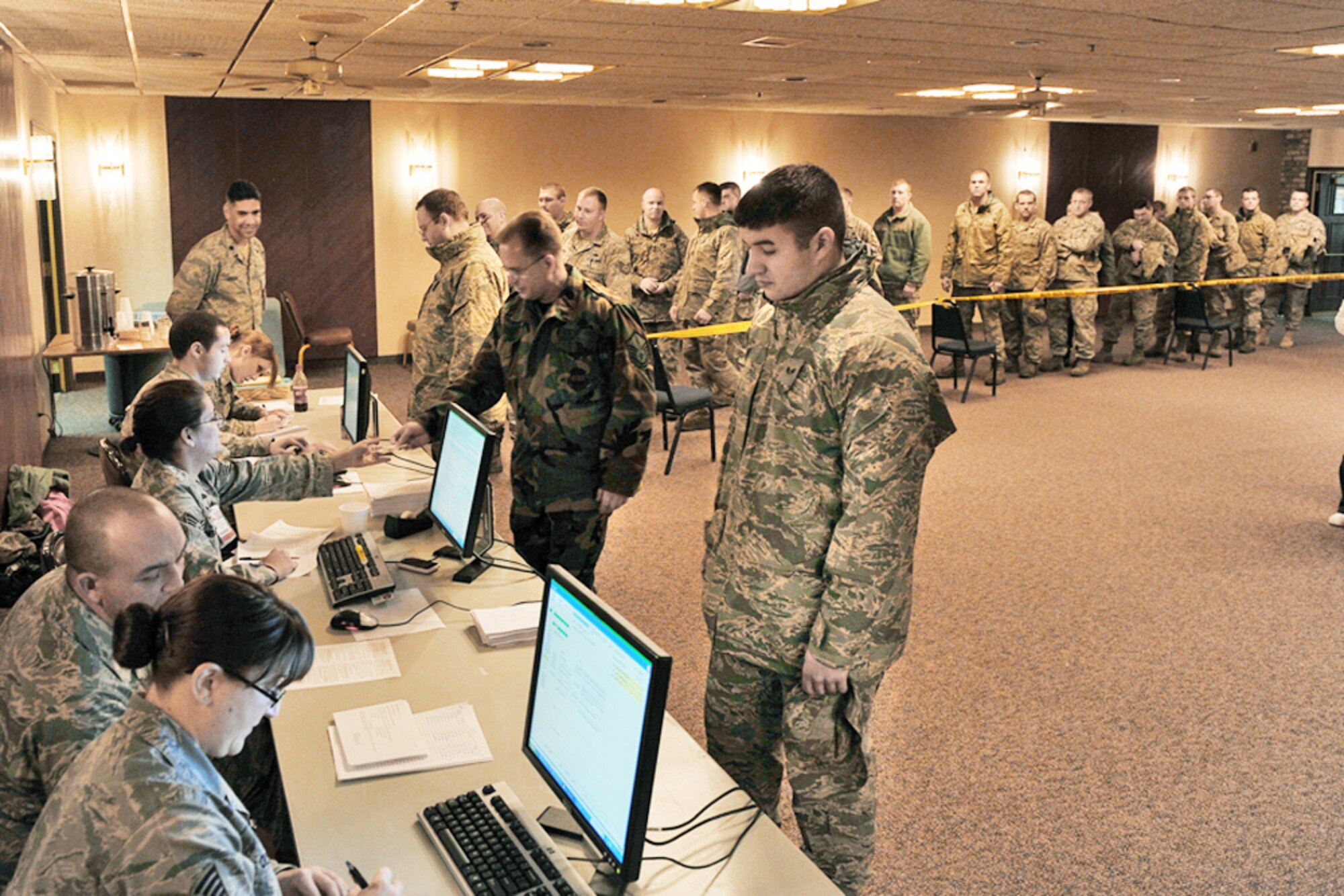 Members of the 55th Medical Group inprocess patients during a point of distribution exercise Jan. 21, 2010, at Offutt Air Force Base, Neb. More than 1,000 active-duty servicemembers processed through the center to test the 55th Wing's ability to respond to a public health emergency. (U.S. Air Force photo/Charles Haymond)
