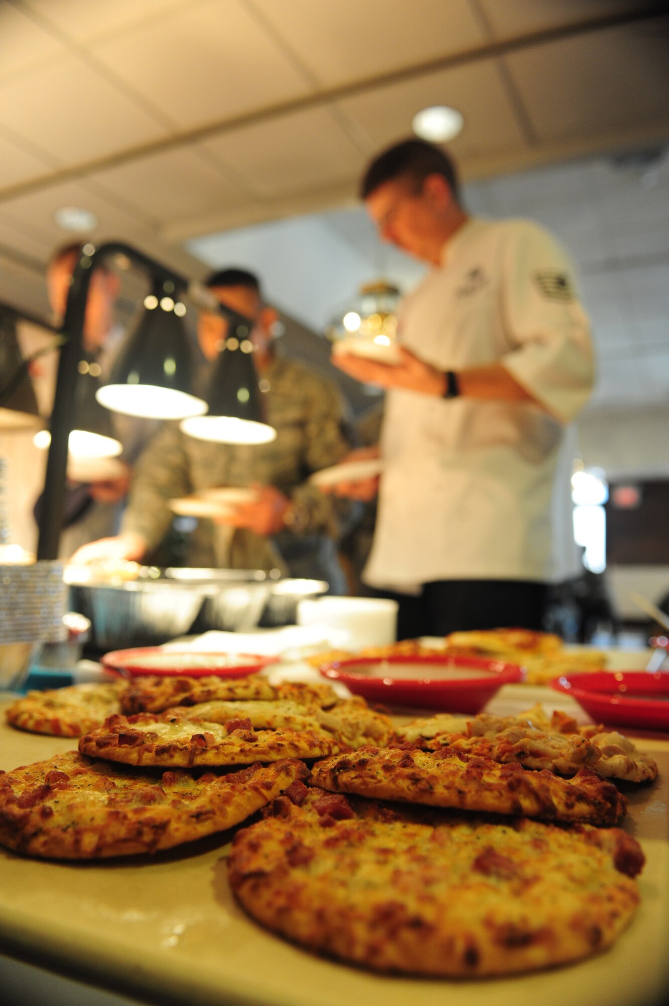 ELLSWORTH AIR FORCE BASE, S.D. -- Fresh flat-bread pizza is displayed before being cut and served to Airmen during a taste-testing event, Jan 27.  The Bandit Inn hosted a taste-testing event for Airmen to help them create a new menu. (U.S. Air Force photo/Airman 1st Class Anthony Sanchelli)
