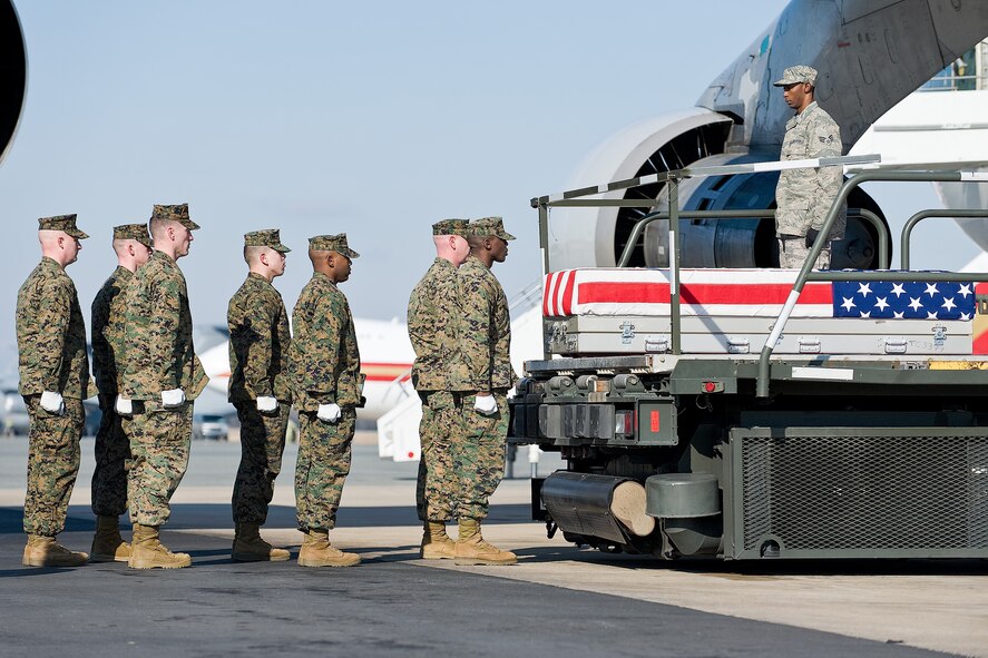 A U.S. Marine Corps team transfers the remains of Marine Corps Lance Cpl. Jeremy M. Kane, of Towson, Md., at Dover Air Force Base, Del., January 27. Lance Cpl. Kane was assigned to 4th Light Armored Reconnaissance Battalion, 4th Marine Division, Marine Forces Reserve, based out of Camp Pendleton, Calif. (U.S. Air Force photo/Roland Balik)