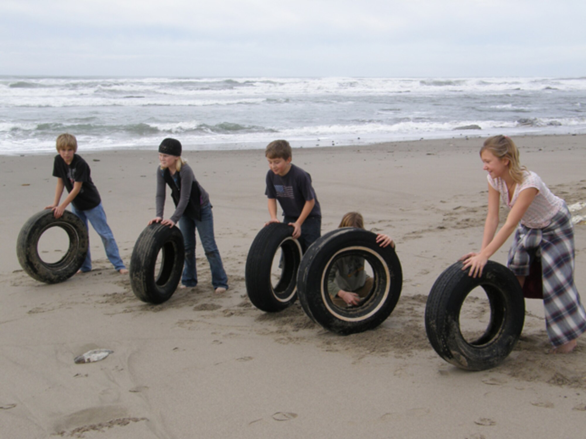 VANDENBERG AIR FORCE BASE, Calif. -- Vandenberg Home-school Inclusive Partnership's youth spent some time cleaning up Wall Beach here Monday, Jan. 25, 2010, after a week of inclement weather in the surrounding area. The team of Vandenberg home-schoolers worked together to remove trash and nine tires from the beach. (Courtesy photo/Vandenberg Home-school Inclusive Partnership)