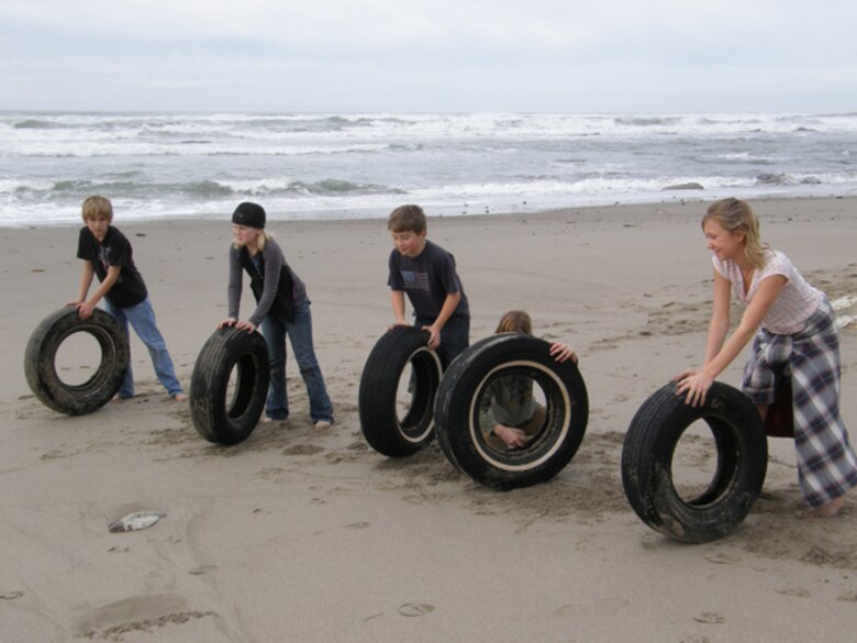 VANDENBERG AIR FORCE BASE, Calif. -- Vandenberg Home-school Inclusive Partnership's youth spent some time cleaning up Wall Beach here Monday, Jan. 25, 2010, after a week of inclement weather in the surrounding area. The team of Vandenberg home-schoolers worked together to remove trash and nine tires from the beach. (Courtesy photo/Vandenberg Home-school Inclusive Partnership)