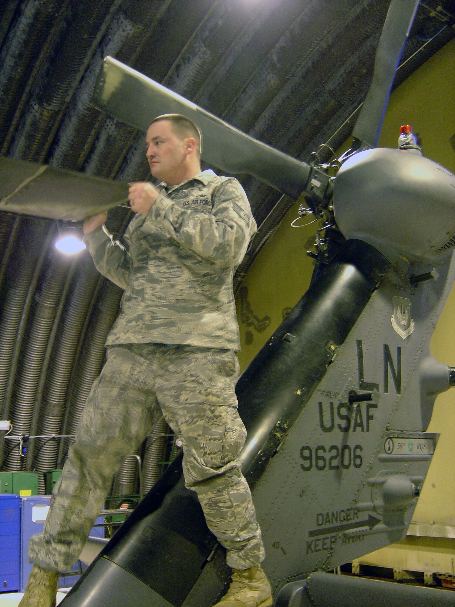 Staff Sgt.  Joshua Skelton, 748th Aircraft Maintenance Squadron, 56th Aircraft Maintenance Unit crew chief, checks a HH-60 Pave Hawk helicopter and prepares it for flight.   Sergeant Skelton was nominated for this Liberty Spotlight by his chain of command because of his excellent maintenance support. (U.S. Air Force photo by Staff Sgt. Connor Estes)