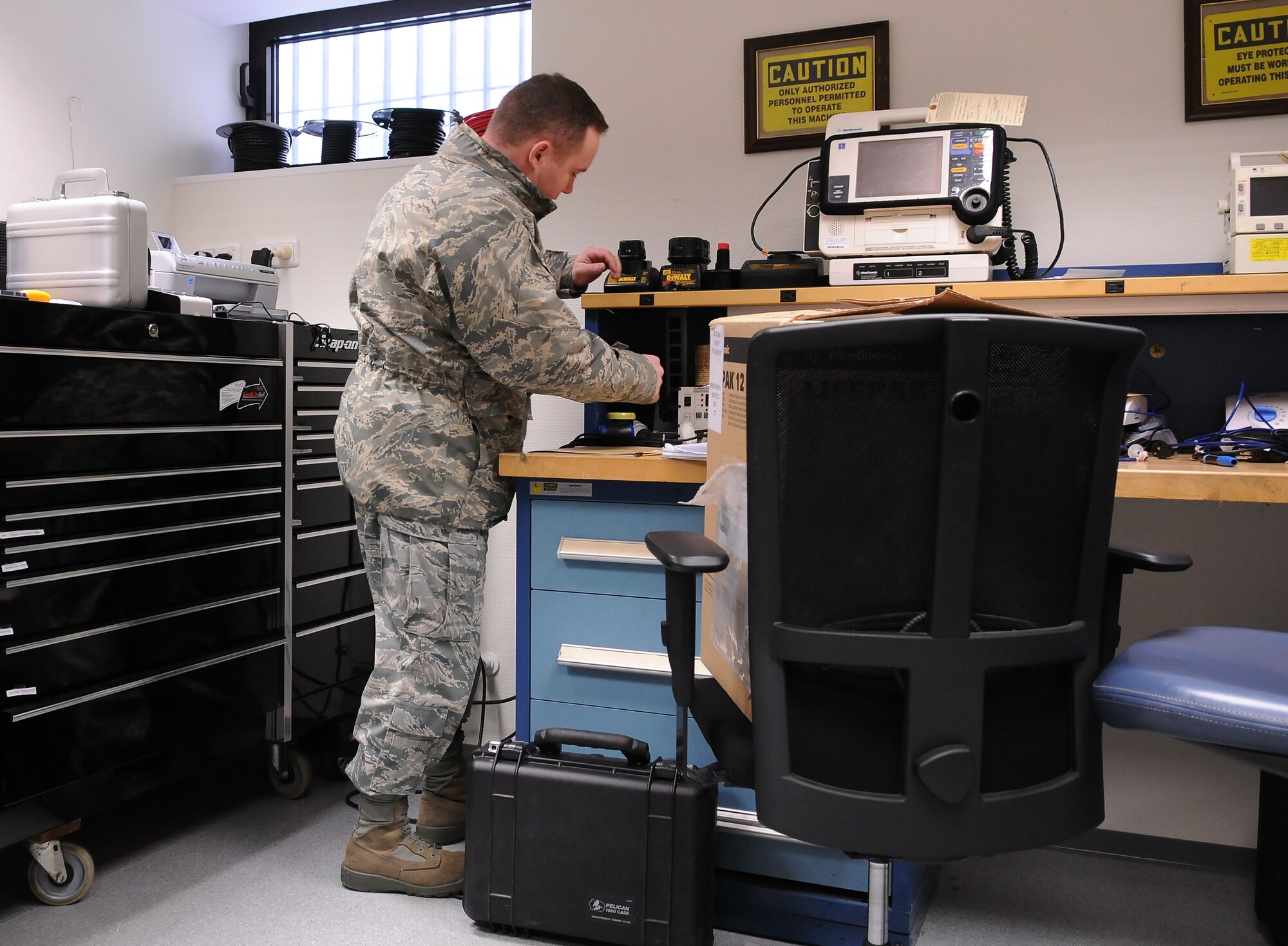 SPANGDAHLEM AIR BASE, Germany -- Tech. Sgt. Anthony Blodgett, 52nd Fighter Wing NCOIC of ground safety, inspects a power cable in the Spangdahlem Medical Clinic Jan. 28. The 52nd Medical Group was inspected by Sergeant Blodgett during the group’s annual safety inspection. (U.S. Air Force photo/Senior Airman Nathanael Callon)