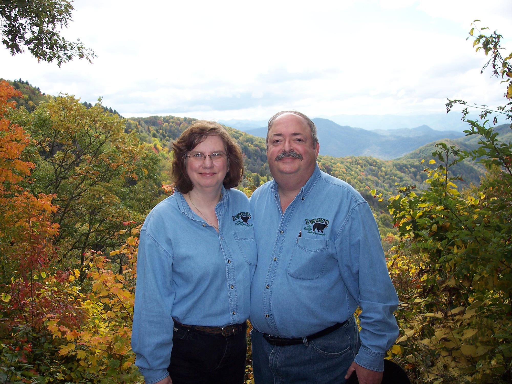 Mary Ann and Phil Kemp pose for a photo of them with the Smoky Mountains (looking into North Carolina) as a backdrop during an RV camping trip they took in October 2008. (Photo provided)