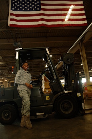Airman 1st Class Samantha Jean is a traffic management apprentice with the 437th Aerial Port Squadron here. Originally from Haiti, she has recently become an American citizen and has found great pride in her part of the relief effort at Charleston AFB working in the packing and crating section of her squadron. (U.S. Air Force photo/Airman 1st Class Lauren Main)
