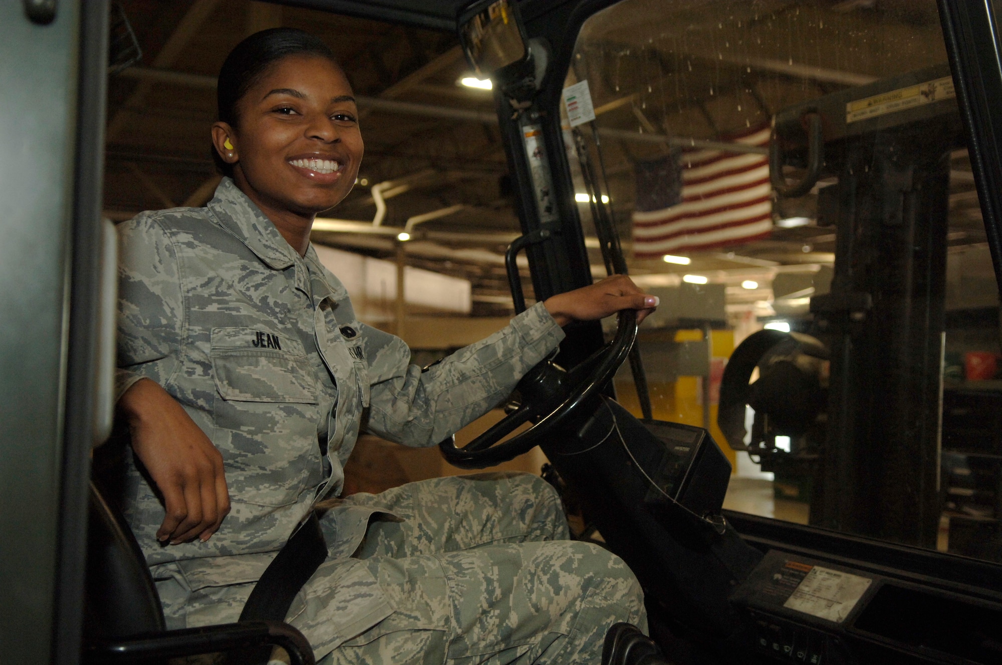 Airman 1st Class Samantha Jean is a traffic management apprentice with the 437th Aerial Port Squadron here. Originally from Haiti, she has recently become an American citizen and has found great pride in her part of the relief effort at Charleston AFB working in the packing and crating section of her squadron. (U.S. Air Force photo/Airman 1st Class Lauren Main)