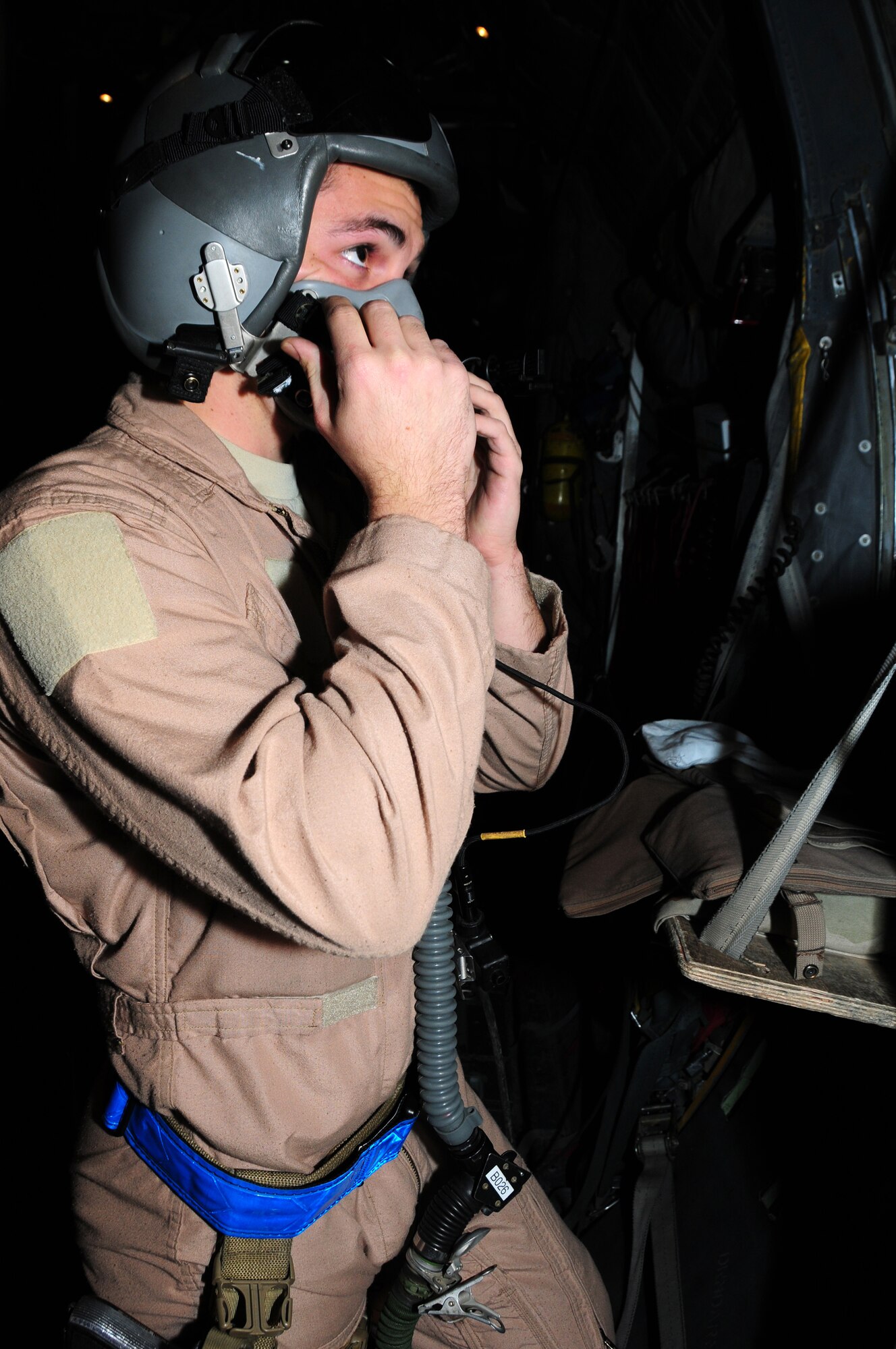 U.S. Air Force Airman 1st Class Jonathan Granata, 737th Expeditionary Airlift Squadron C-130H loadmaster, performs a fit and function check on his equipment as part of a preflight inspection Jan. 12, 2010 at an air base in Southwest Asia. Airman Granata, a Dayton, Ohio, native, is deployed from the 40th Airlift Squadron, Dyess Air Force Base, Texas. (U.S. Air Force photo by Staff Sgt. Lakisha A. Croley/Released)