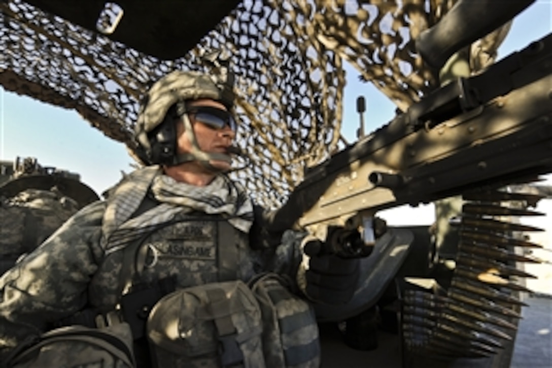 U.S. Army Spc. Aaron Blasingame, from 4th Battalion, 23rd Infantry Regiment, 5th Brigade Combat Team, 2nd Infantry Division, provides rear security inside a Stryker armored vehicle during a combat mission in Helmand province, Afghanistan, on Jan. 15, 2010.  The Army uses the Stryker in its day-to-day operations because of its unique combination of maneuverability and firepower.  