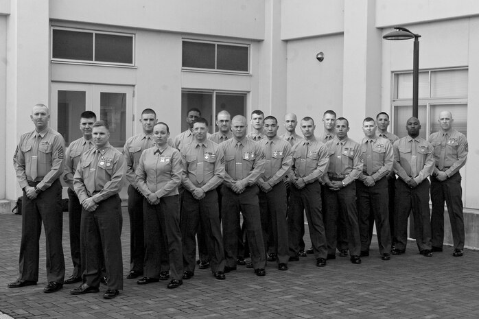 Iwakuni Marines pose for a group picture at the Building 1 courtyard here Jan. 29 after competing in the Far East Division Rifle and Pistol Team Competitions at Marine Corps Base Camp Smedley D. Butler, Okinawa Japan. Representing Combat Logistics Company 36 at the competition were Maj. James Whiteker, 2nd Lt. Christopher Czepiel, Staff Sgt. Ajene Webley, Sgt. Sean Regan, Sgt. Joey Marbley, Sgt. Rebecca Kubica, Cpl. Aaron Marsh, Cpl. Kristopher Haney, Lance Cpl. David Garlitz, and Lance Cpl. Gus Norita. Representing Marine Aircraft Group 12 at the competition were Chief Warrant Officer 3 Christopher Joy, Gunnery Sgt. James Walters, Gunnery Sgt. Benjamin Armijo, Sgt. Fabio Salas, Cpl. Joshua Pelletier, Lance Cpl. Justin Moses, Lance Cpl. Richard Malad, and Lance Cpl. Raymond Chin. Representing Marine Wing Support Squadron 171 was Gunnery Sgt. William Janssen.