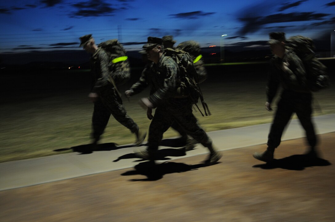 Marines from the station’s Installation Personnel Administration Center complete a 5-mile course at the Marine Corps Air Station in Yuma, Ariz., Jan. 28, 2010, in order to prepare for the Bataan Memorial Death March in New Mexico on March 21, 2010. The event celebrates the adversity and hardships faced by the nearly 75,000 Americans and Filipinos forced across the Bataan Peninsula to internment camps by the Japanese during World War II.