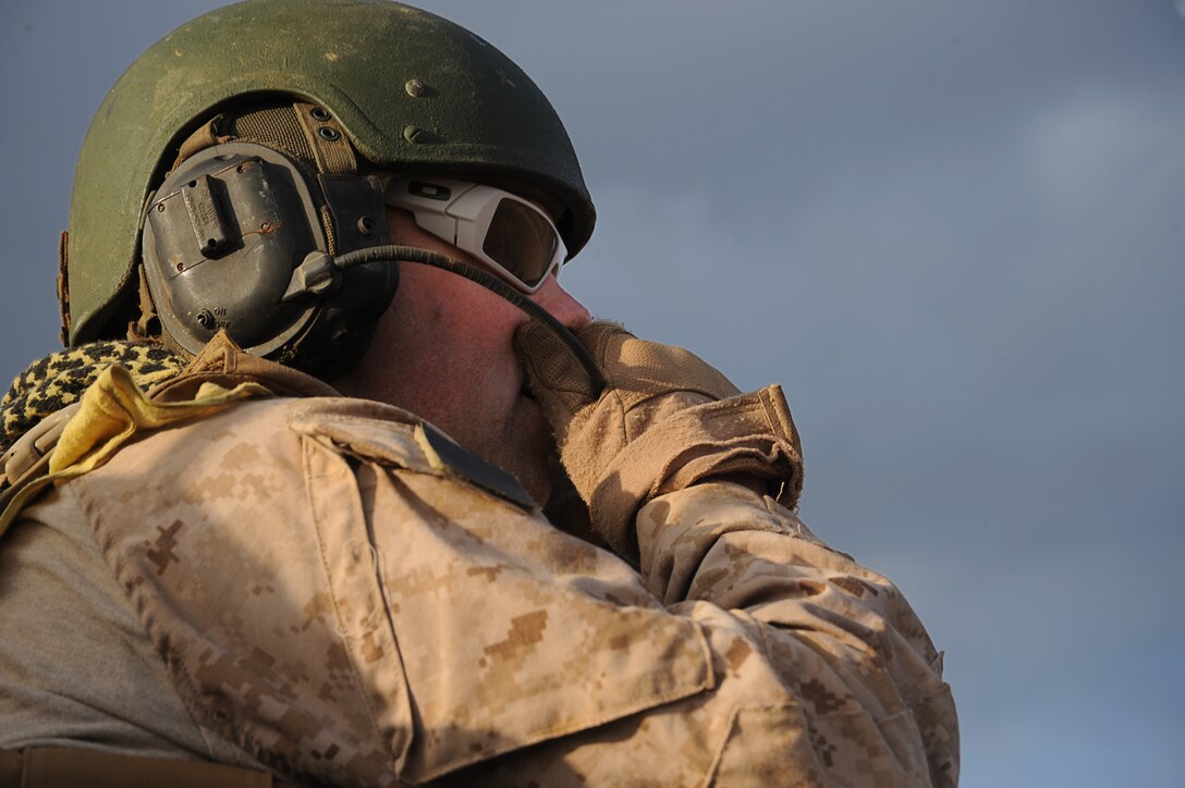 Gunnery Sgt. Matt Vickers, from Decatur, Ill., rides in a light armored vehicle here Jan. 28. Vickers, and other Marines with Light Armored Reconnaissance Platoon, Weapons Company, Battalion Landing Team 2/4, 11th Marine Expeditionary Unit, conducted live-fire weapons shoots and trained with the French Army Jan. 28-Feb. 5. Vickers is the LAR platoon sergeant.