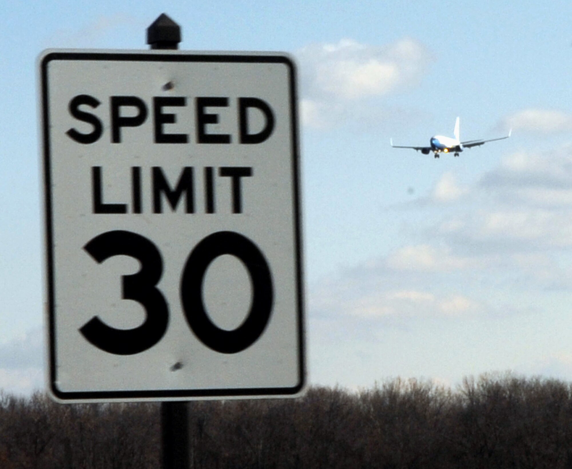 One of the beautiful 932nd Airlift Wing C-40C planes makes an afternoon approach near the south end of the runway at Scott AFB, Ill.  The Air Force Reserve Command wing flies three of the aircraft. (U.S. Air Force photo/Maj. Stan Paregien)