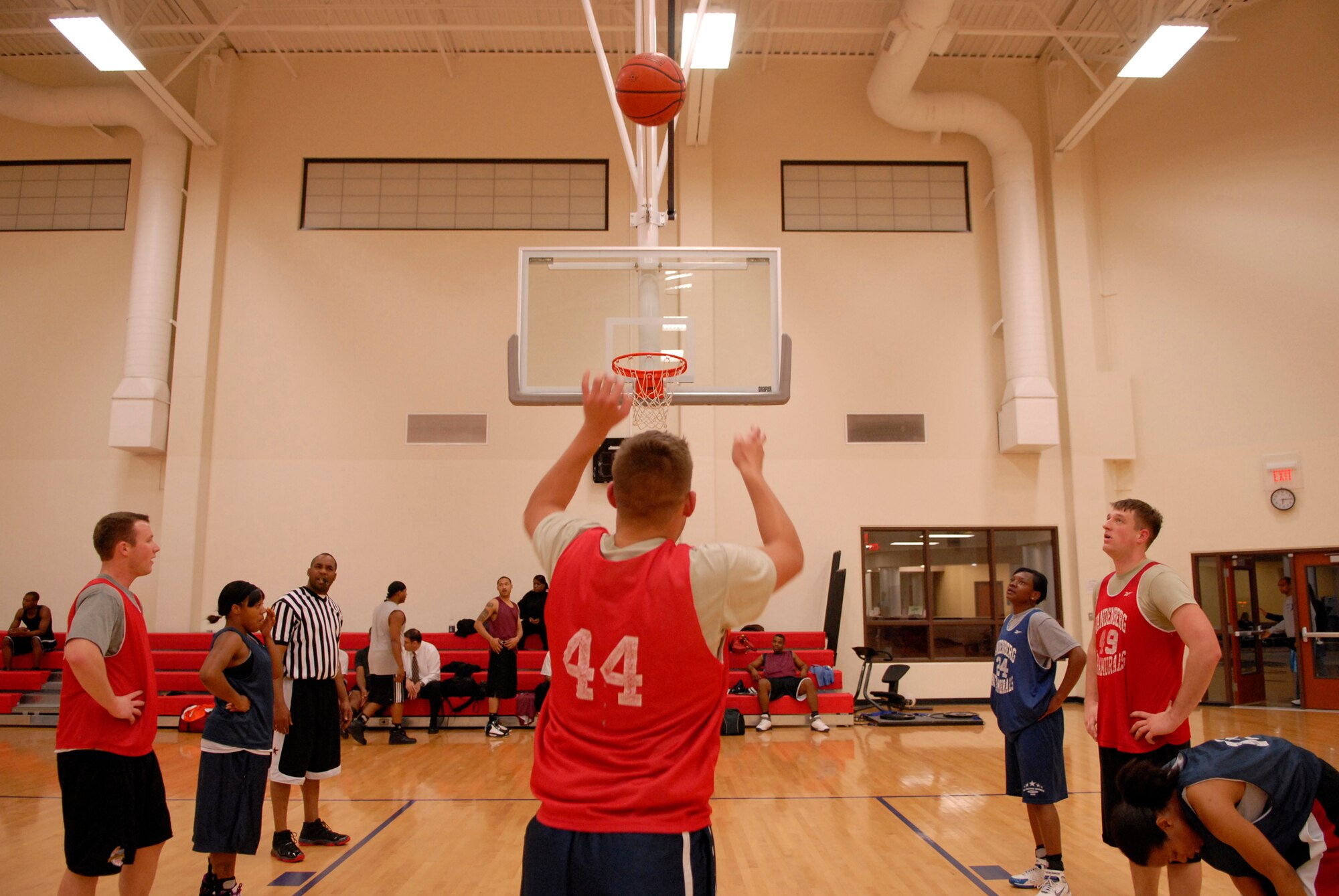 VANDENBERG AIR FORCE BASE, Calif. -- Myles Macey makes his first free throw during an intramural basketball game at the Vandenberg Fitness Center here Thursday, Jan. 28, 2010.  The 30th Operations Group team battled against the Lady Hawks, winning 57-23.   (U.S. Air Force photo/Senior Airman Andrew Satran) 

 

 
 

 

 

 
 

 
 