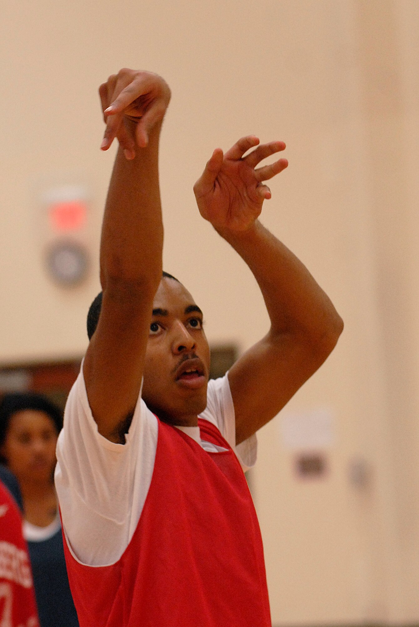 VANDENBERG AIR FORCE BASE, Calif. -- Steven Sutton holds his posture after his free throw during an intramural basketball game at the Vandenberg Fitness Center here Thursday, Jan. 28, 2010.  The 30th Operations Group battled against the Lady Hawks, winning 57-23.  (U.S. Air Force photo/Senior Airman Andrew Satran) 

 
 

 
 