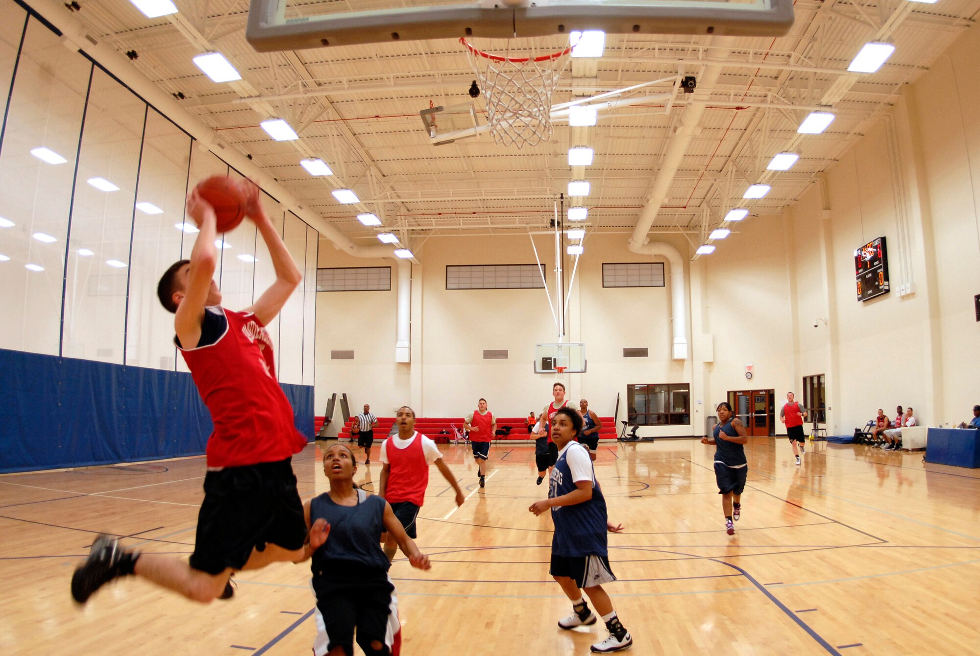 VANDENBERG AIR FORCE BASE, Calif. -- Justin Holtz leaps to take a shot during an intramural basketball game at the Vandenberg Fitness Center here Thursday, Jan. 28, 2010. The 30th Operations Group battled against the Lady Hawks, winning 57-23.   (U.S. Air Force photo/Senior Airman Andrew Satran) 

 

 
 