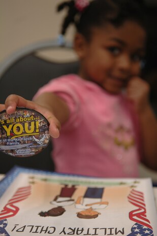 Reece Walker shows off her button at the Deployed Spouses Appreciation dinner hosted by the airman family readiness center along with the base chapel Jan. 28. The dinner was hosted to provide support for the spouses and families with deployed service members. Reece is the daughter of Staff Sgt. Dantrell Walker who is currently deployed to the middle east. Sgt. Walker is a pavement and equipment craftsman assigned to the 628th Civil Engineering Squadron. (U.S. Air Force Photo/Airman 1st Class Lauren Main)