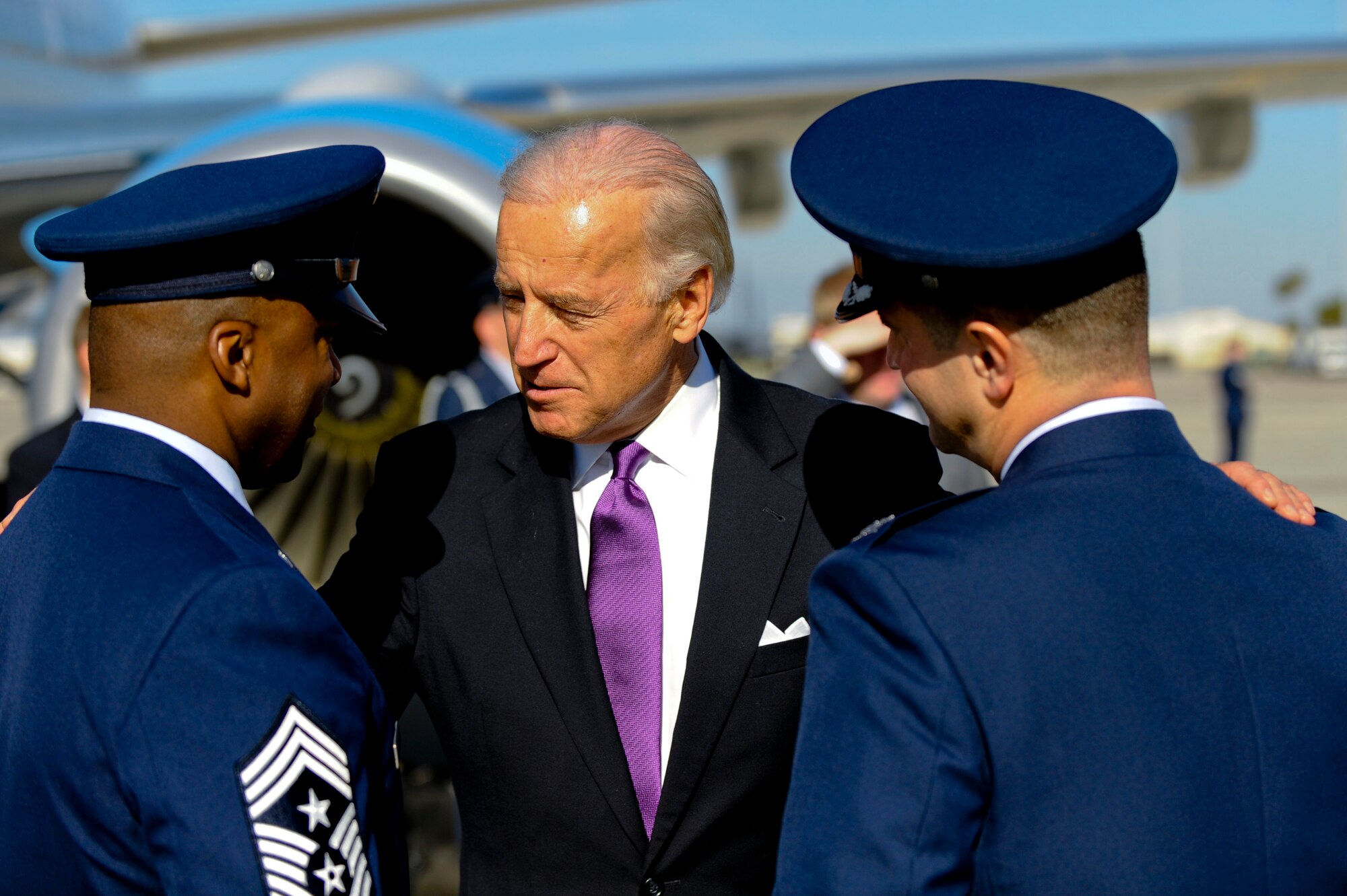 U.S. Vice President Joe Biden talks with Col. David Cohen, 6th Air Mobility Wing Vice Commander, and Chief Master Sgt. Derrick Crowley, 6th Air Mobility Wing Command Chief, during the Vice President's visit to MacDill Air Force Base, Fla., Jan. 28, 2010.  President Obama and Vice President Biden landed at MacDill in Tampa, Fla. to conduct a townhall-style meeting at the University of Tampa. (U.S. Air Force photo by Staff Sgt. Joseph L. Swafford/Released)