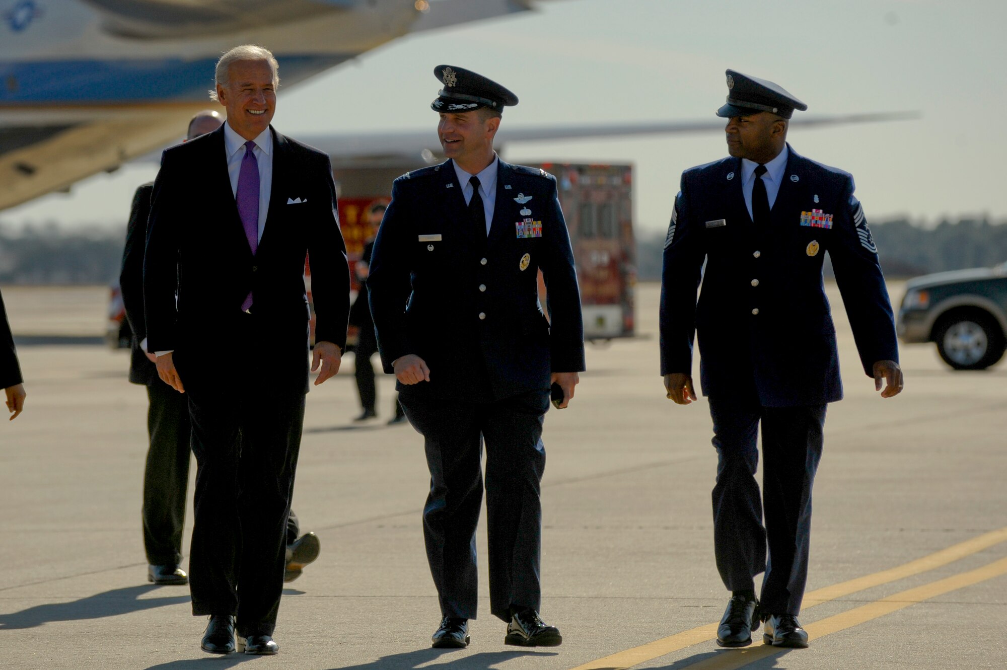 U.S. Vice President Joe Biden walks with Col. David Cohen, 6th Air Mobility Wing Vice Commander, and Chief Master Sgt. Derrick Crowley, 6th Air Mobility Wing Command Chief, before the Vice President's departure at MacDill Air Force Base, Fla., Jan. 28, 2010.  President Obama and Vice President Biden landed at MacDill in Tampa, Fla. to conduct a townhall-style meeting at the University of Tampa. (U.S. Air Force photo by Staff Sgt. Joseph L. Swafford/Released)