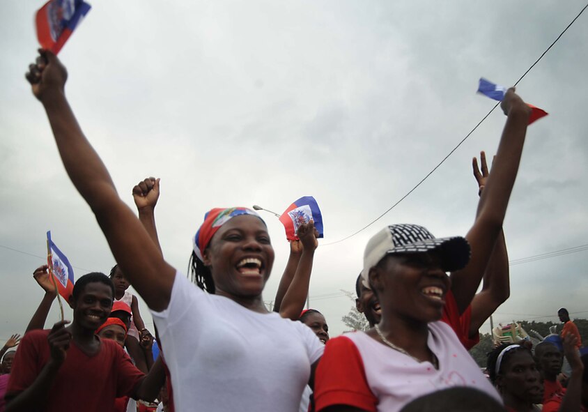 Earthquake survivors sing and dance on Toussant Boulevard in Port-au-Prince, Haiti, Jan. 26, 2010. Department of Defense assets have been deployed to assist in the Haiti relief effort following a 7-magnitude earthquake that hit the city on January 12, 2010. (DoD photo by Mass Communication Specialist 2nd Justin E. Stumberg, U.S. Navy/Released) 