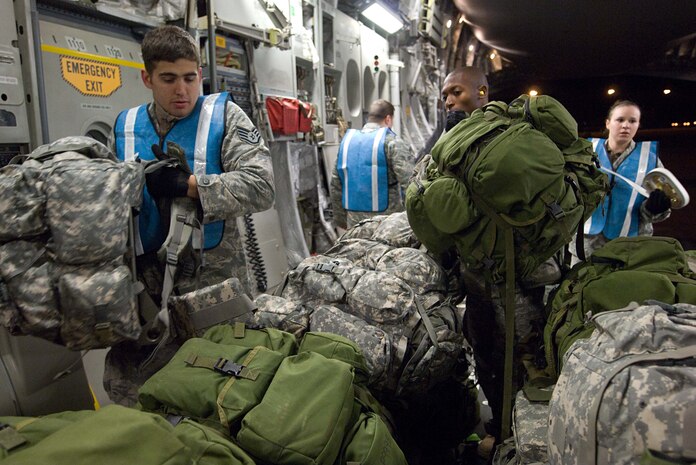 Airmen load cargo onto a Charleson Air Force Base C-17 at Moody Air Force Base, Ga., Jan. 28. The cargo will be used to support humanitarian relief efforts in Haiti. (U.S. Air Force photo/Staff Sgt. Barry Loo)