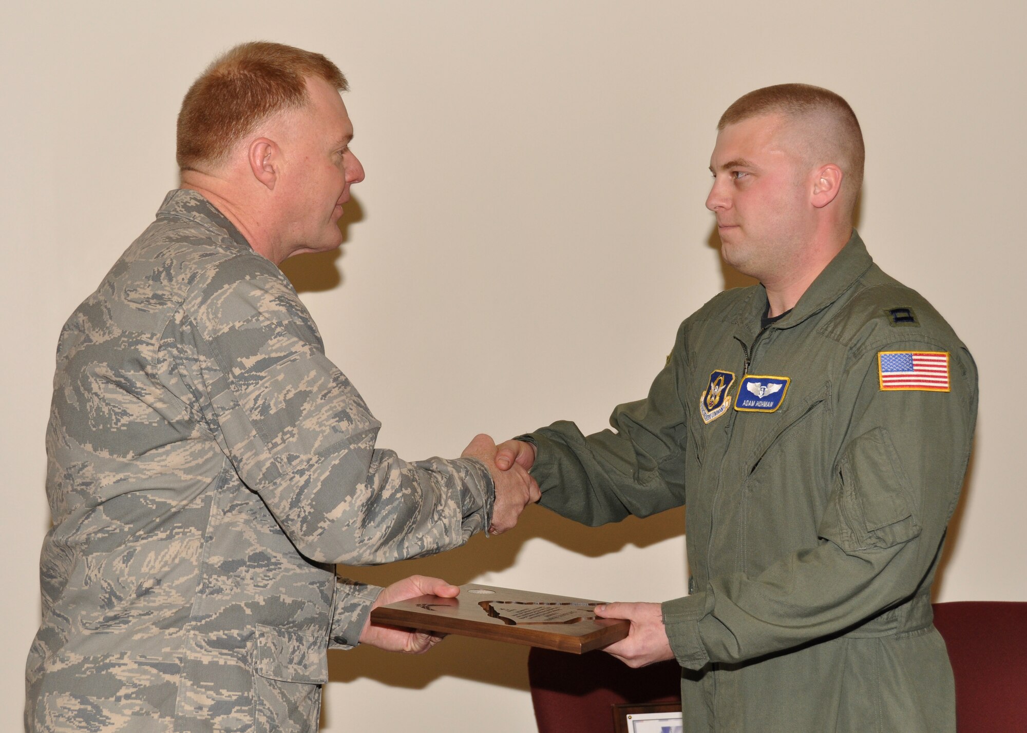 Capt. Adam Hohman, 934th Aeromedical Evacuation Squadron, receives the Gen. Peter K. Sullivan award from Col. Ron Wilt, 934th Operations Group commander Jan. 11. Captain Hohman earned the award for exceptional mentoring and leadership at the Reserve Officer Develpment Course. Air Force Photo/Senior Airman Noah Johnson) 