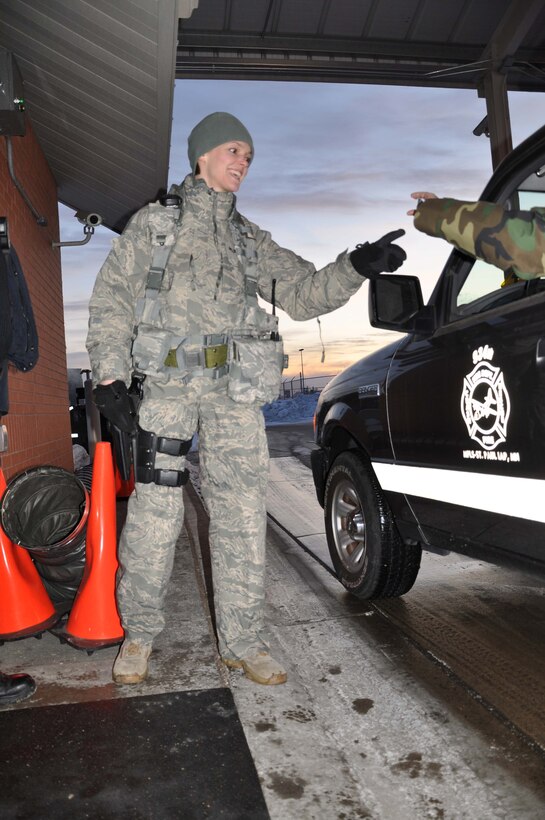 Staff  Sgt. Grace Bisch, 934th Security Forces Squadron, checks IDs at the gate in sub-zero temperatures Jan 11. (Air Force Photo, Tech. Sgt. Bob Sommer)