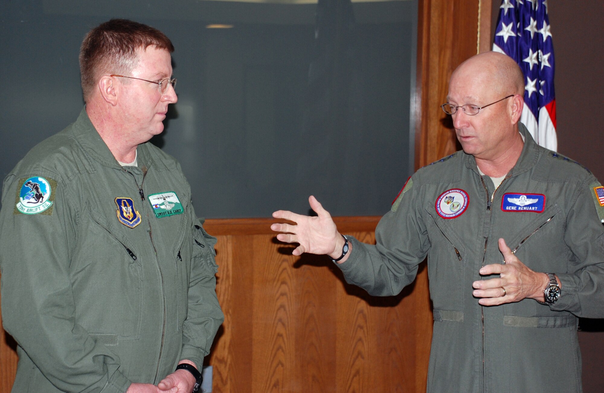 Gen. Victor Renuart, right, talks with Senior Master Sgt. Dave Carey just before reading the 731st Airlift Squadron flight engineer the oath of enlistment Jan. 28 at Peterson Air Force Base, Colo. This was Sergeant Carey's final reenlistment, which will take him to 38 years in the Air Force.  "We'll continue to ask for your leadership, for your good attitude, for your support and to help grow the next group of 'you,'" said General Renuart. "You know what we expect of you, to continue to be the pro that you are." (U.S. Air Force photo/Tech. Sgt. Daniel Butterfield)