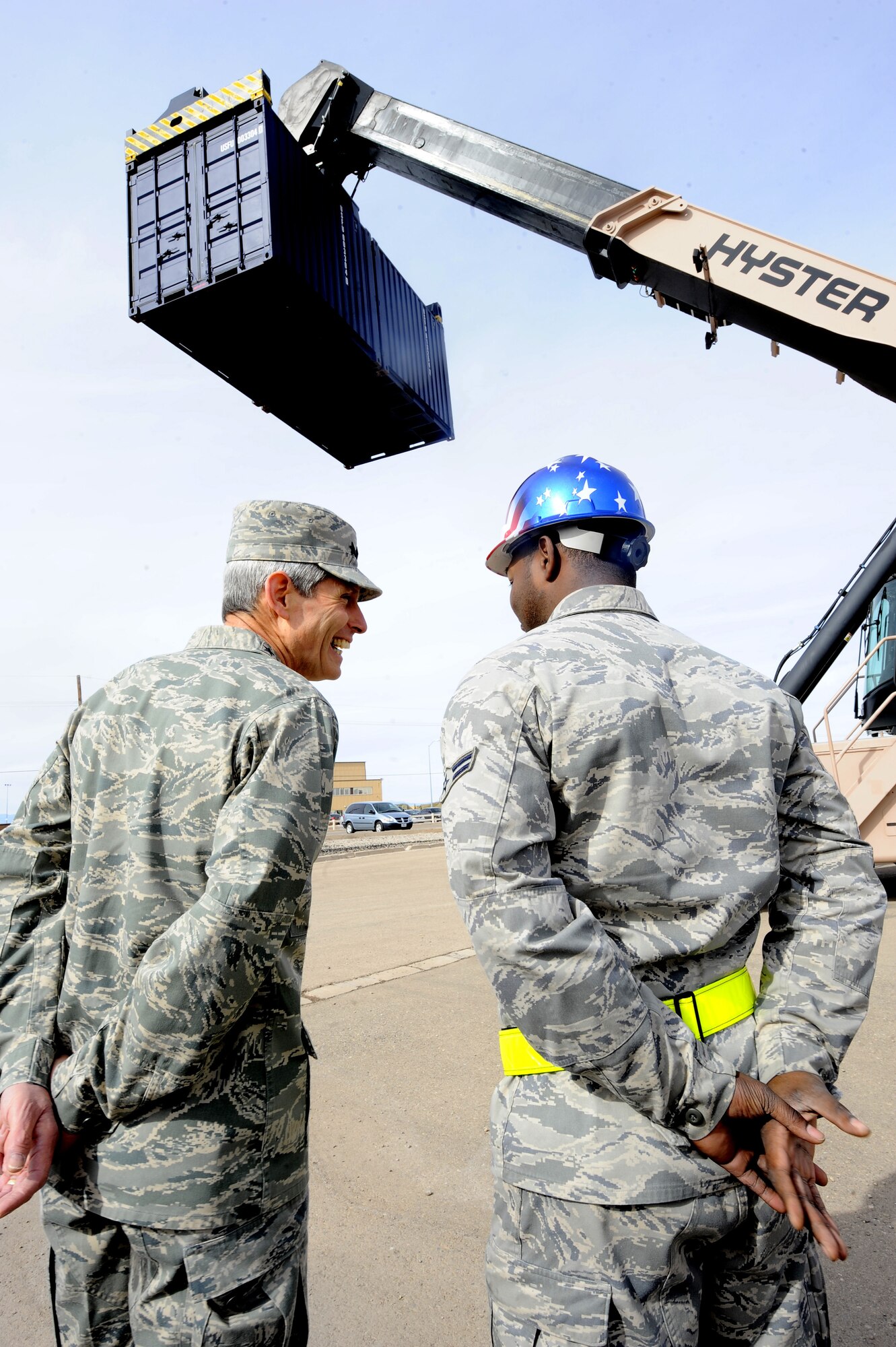 HOLLOMAN AIR FORCE BASE, N.M. -- Air Force Chief of Staff Gen. Norton Schwartz and Airman 1st Class Ricky Rivers, 49th Materiel Maintenance Group, watch a Hyster Yardmaster II Reach Stacker lift a sea-land container at the 49th MMG's Basic Expeditionary Airfield Resources Base, Jan. 27. General Schwartz visited Holloman to see Airmen and operations first-hand. (U.S. Air Force photo by Airman 1st Class Veronica Stamps)