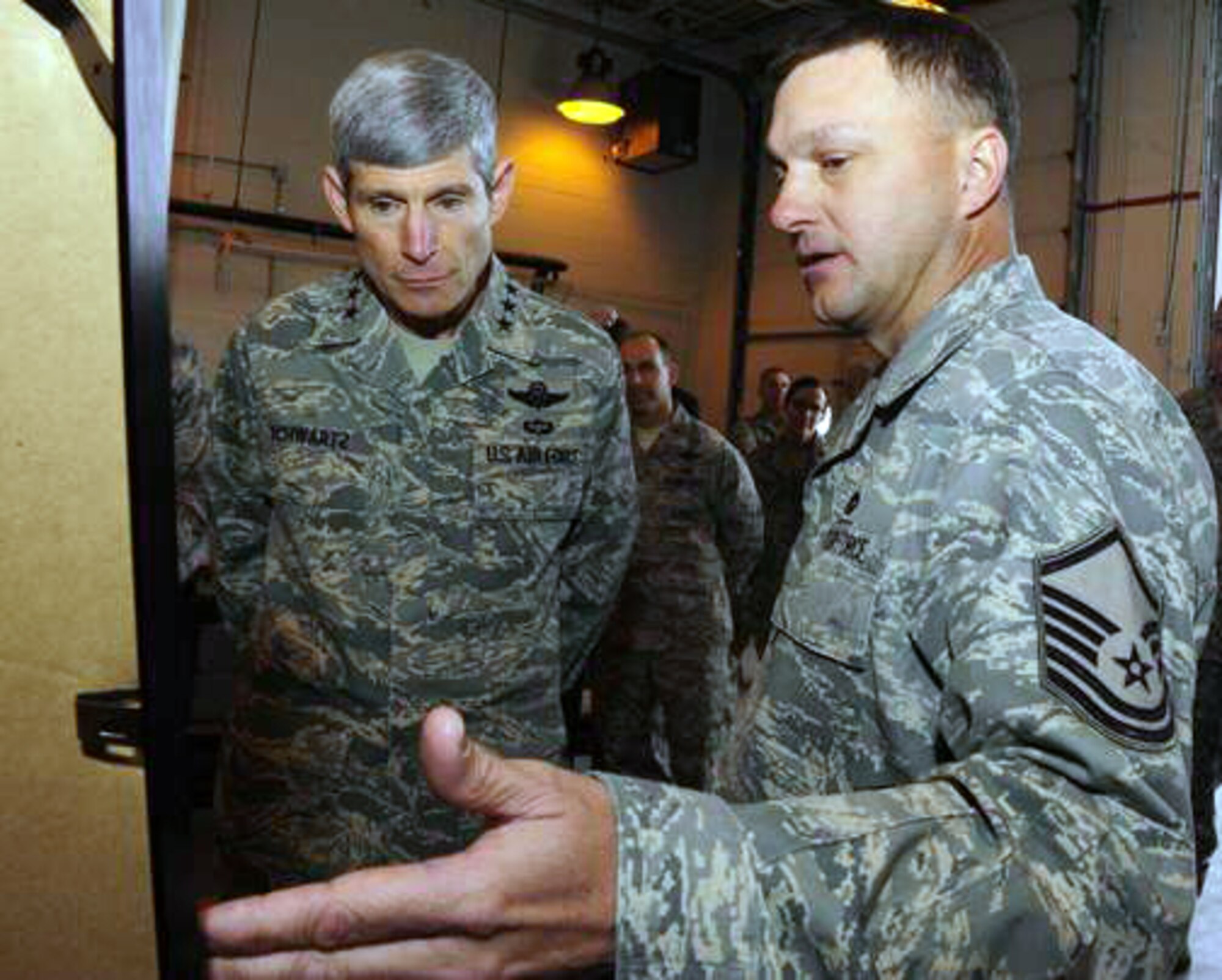 Air Force Chief of Staff Gen. Norton Schwartz is briefed on the remote piloted aircraft facility plan by Master Sgt. Ernest Penton Jan. 27, 27, 2010, at Holloman Air Force Base, N.M. General Schwartz visited Holloman AFB to see Airmen and operations firsthand. Sergeant Penton is assigned to the 49th Aircraft Maintenance Squadron. (U.S. Air Force photo/Senior Airman Tiffany Trojca)
