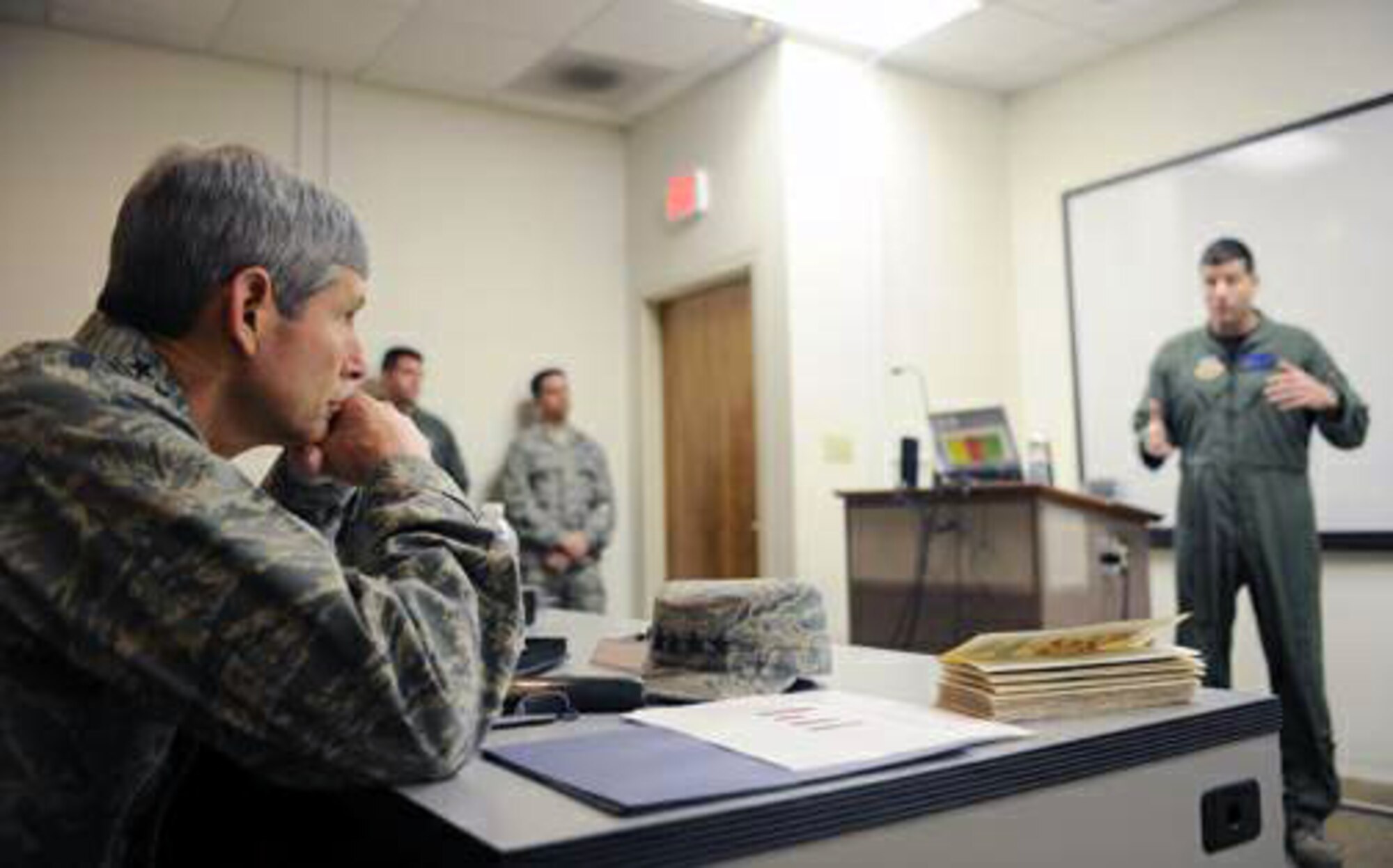 Air Force Chief of Staff Gen. Norton Schwartz listens to Lt. Col. Mike Hernandez during an F-22 Raptor briefing Jan. 27, 2010, at Holloman Air Force Base, N.M. General Schwartz visited Holloman AFB to see Airmen and operations firsthand. Colonel Hernandez is the 7th Fighter Squadron commander. (U.S. Air Force photo/Airman 1st Class Veronica Stamps)